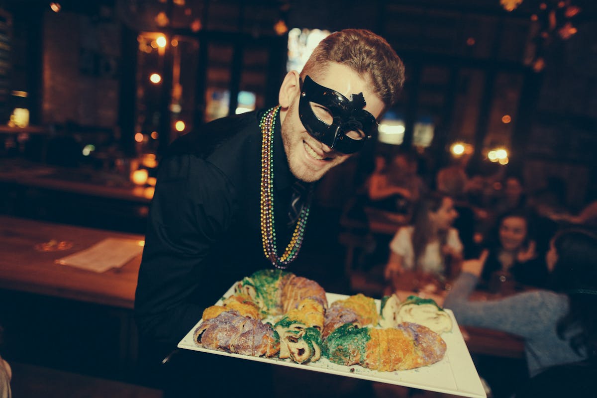 Server with Food - Mardi-Gras Ball 2017 at Treadwell Park