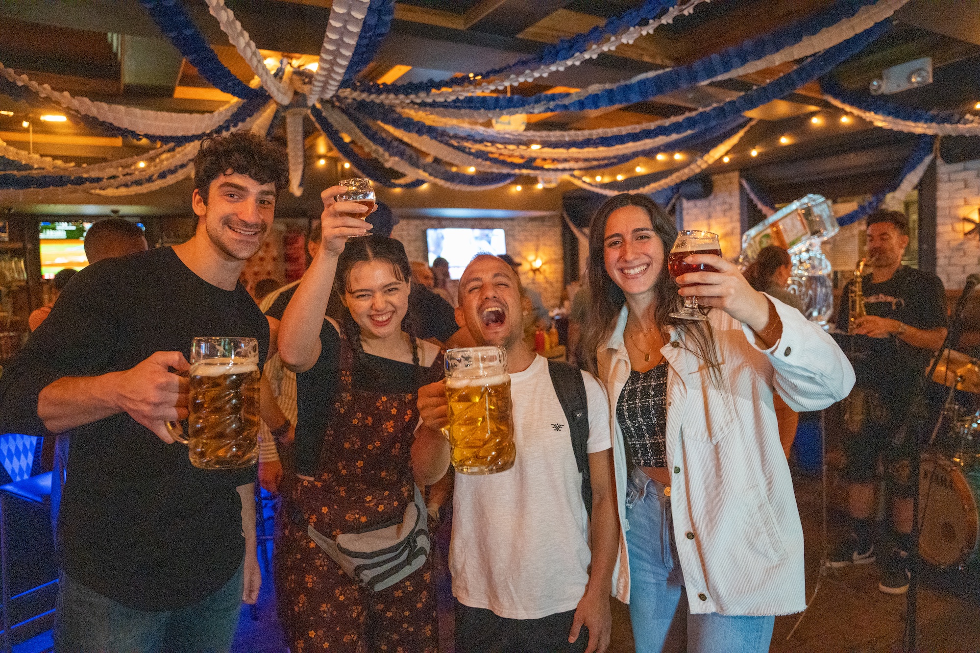 Treadwell Park Oktoberfest guests toasting beer