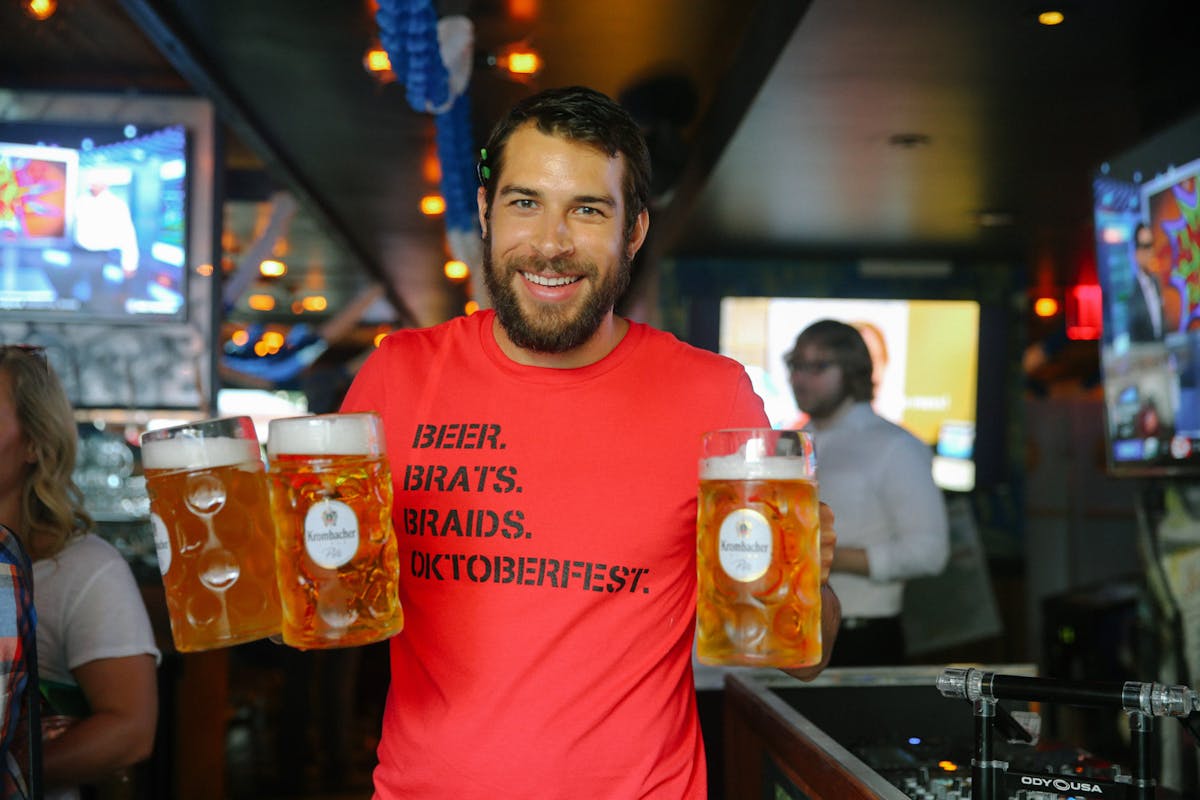 man holding beers