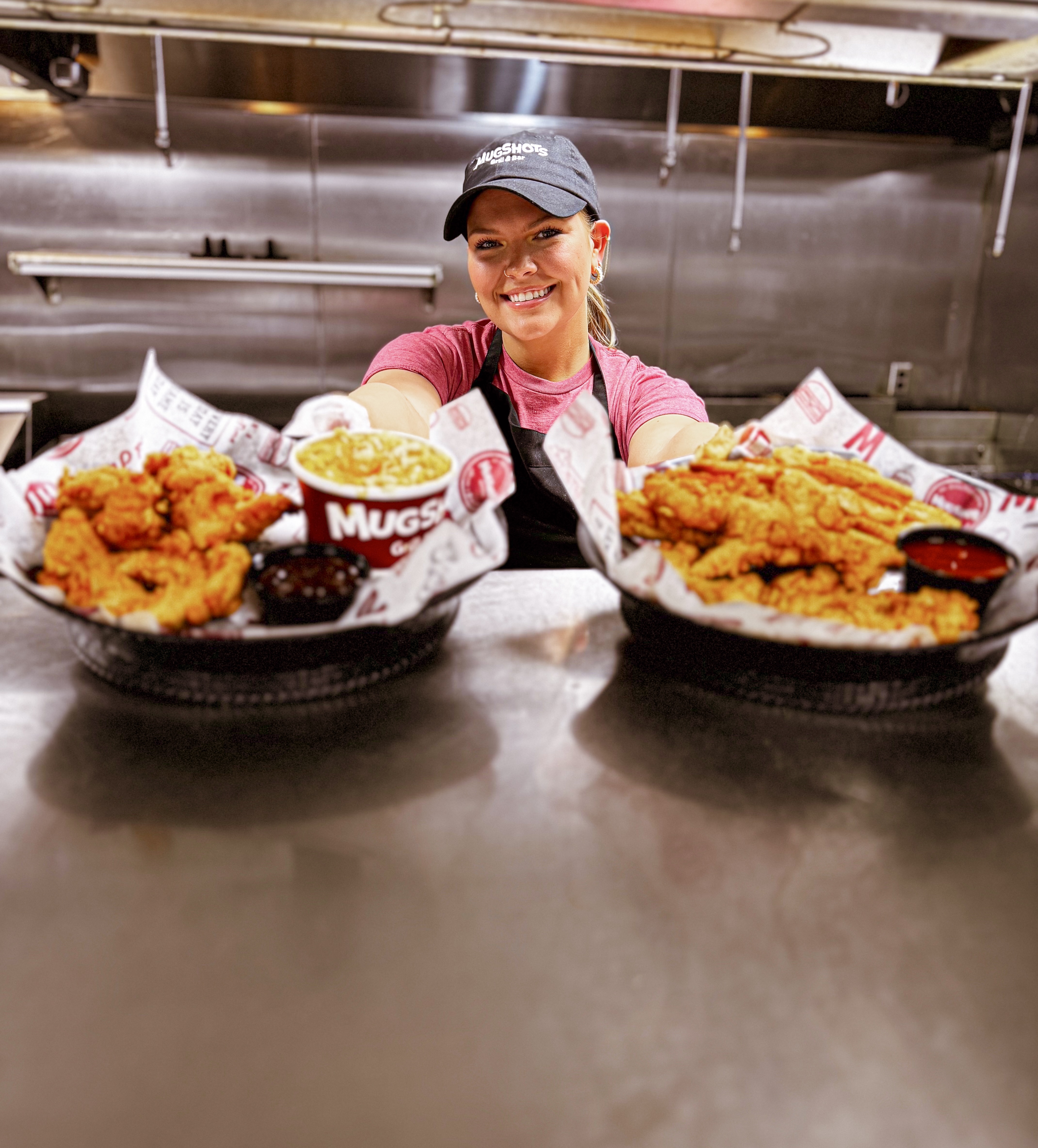 a person sitting at a table with a plate of food