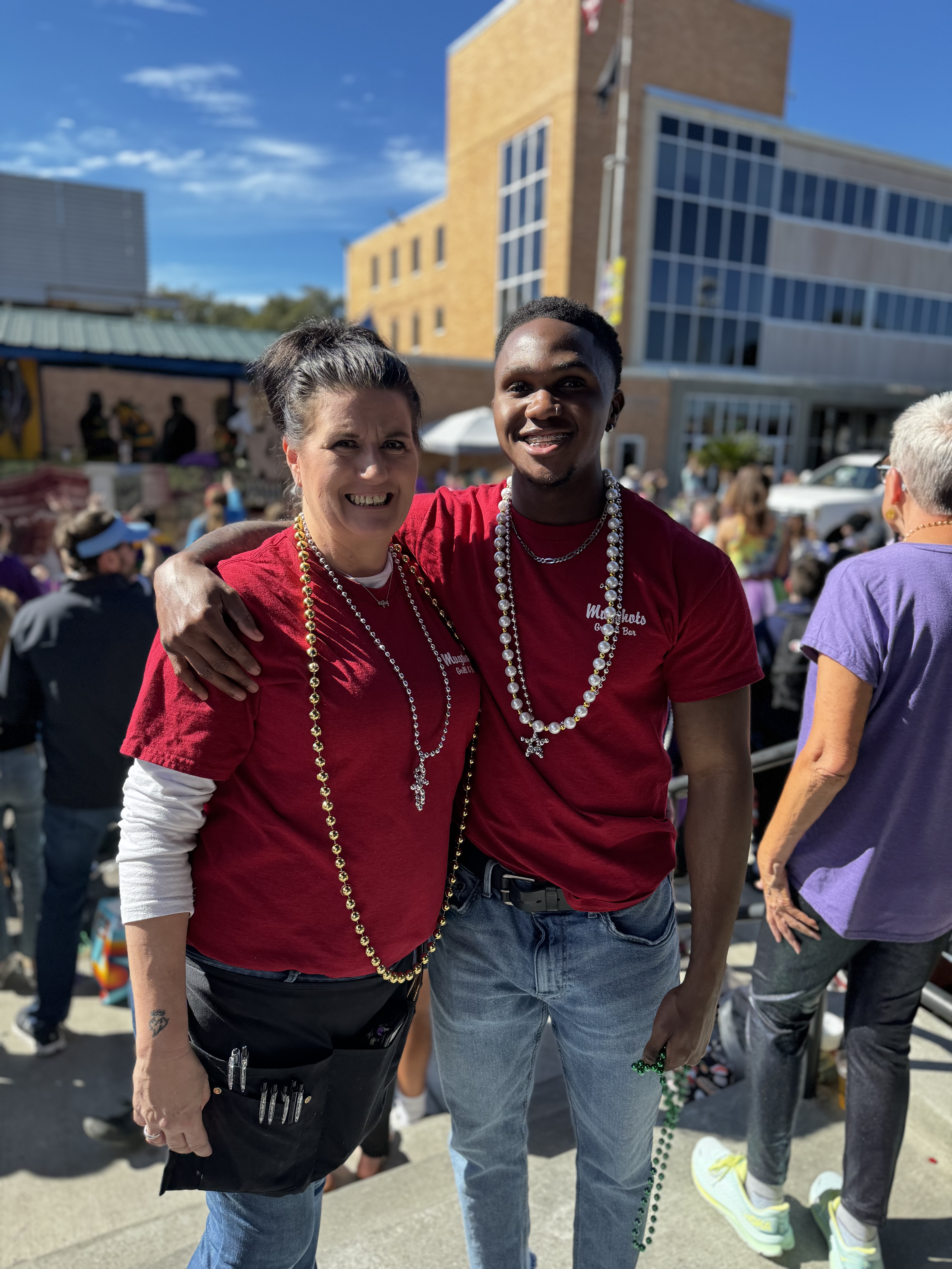 a man and a woman standing in front of a building