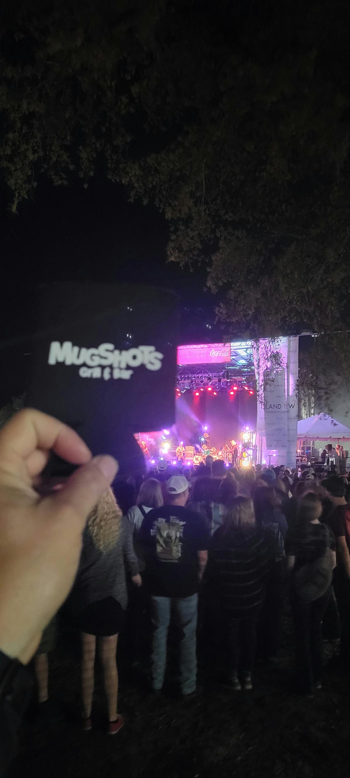 a person holding a coozie