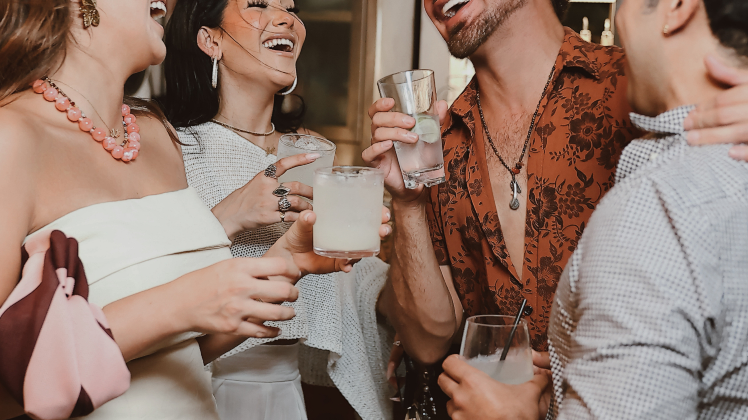 Group of guests enjoying cocktails together at Z on 23 rooftop bar in Downtown Houston
