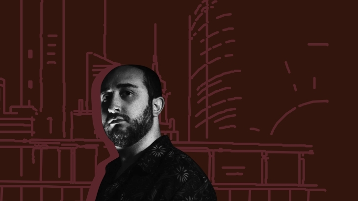 DJ Rick Arter in front of a red backdrop