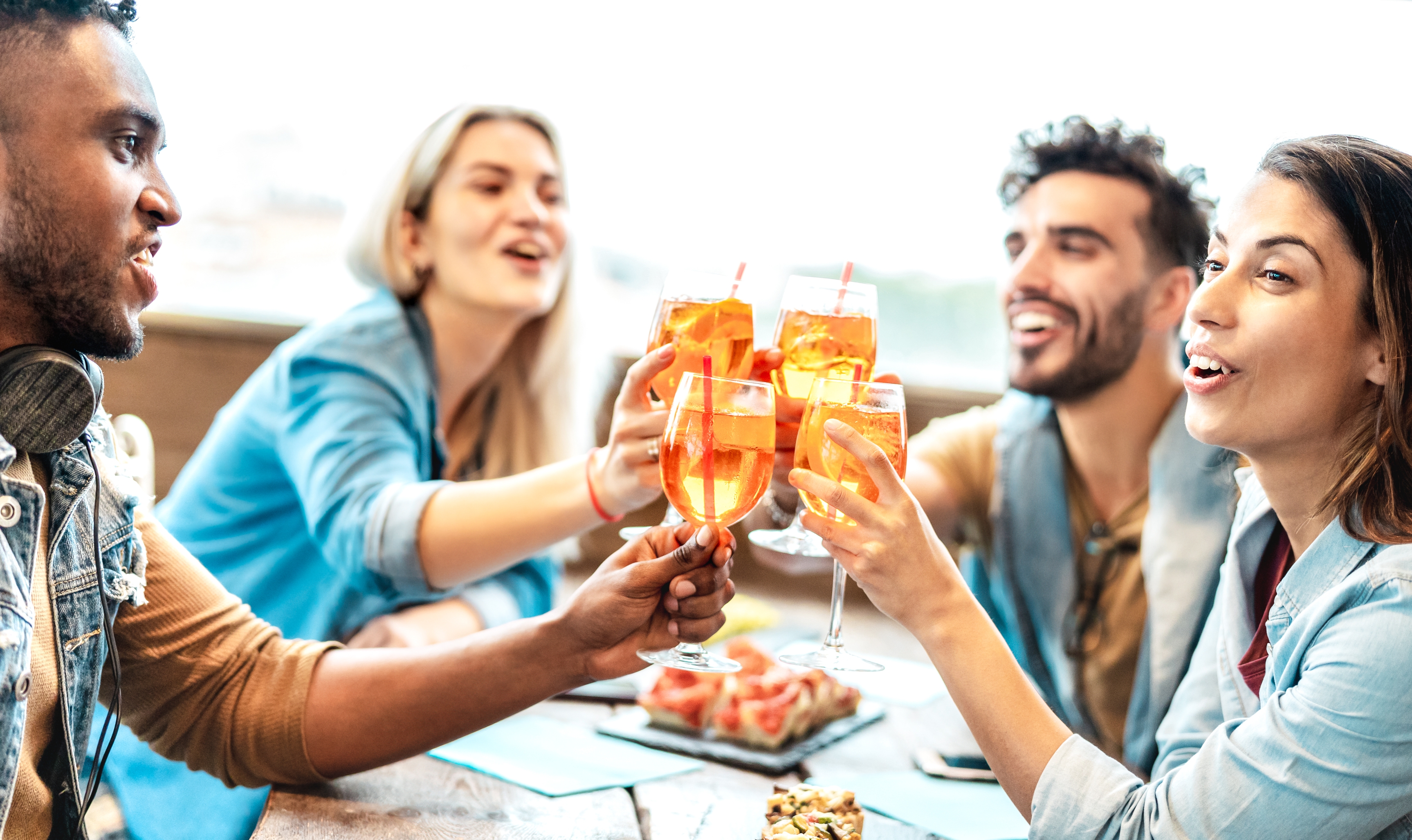 a group of people holding wine glasses