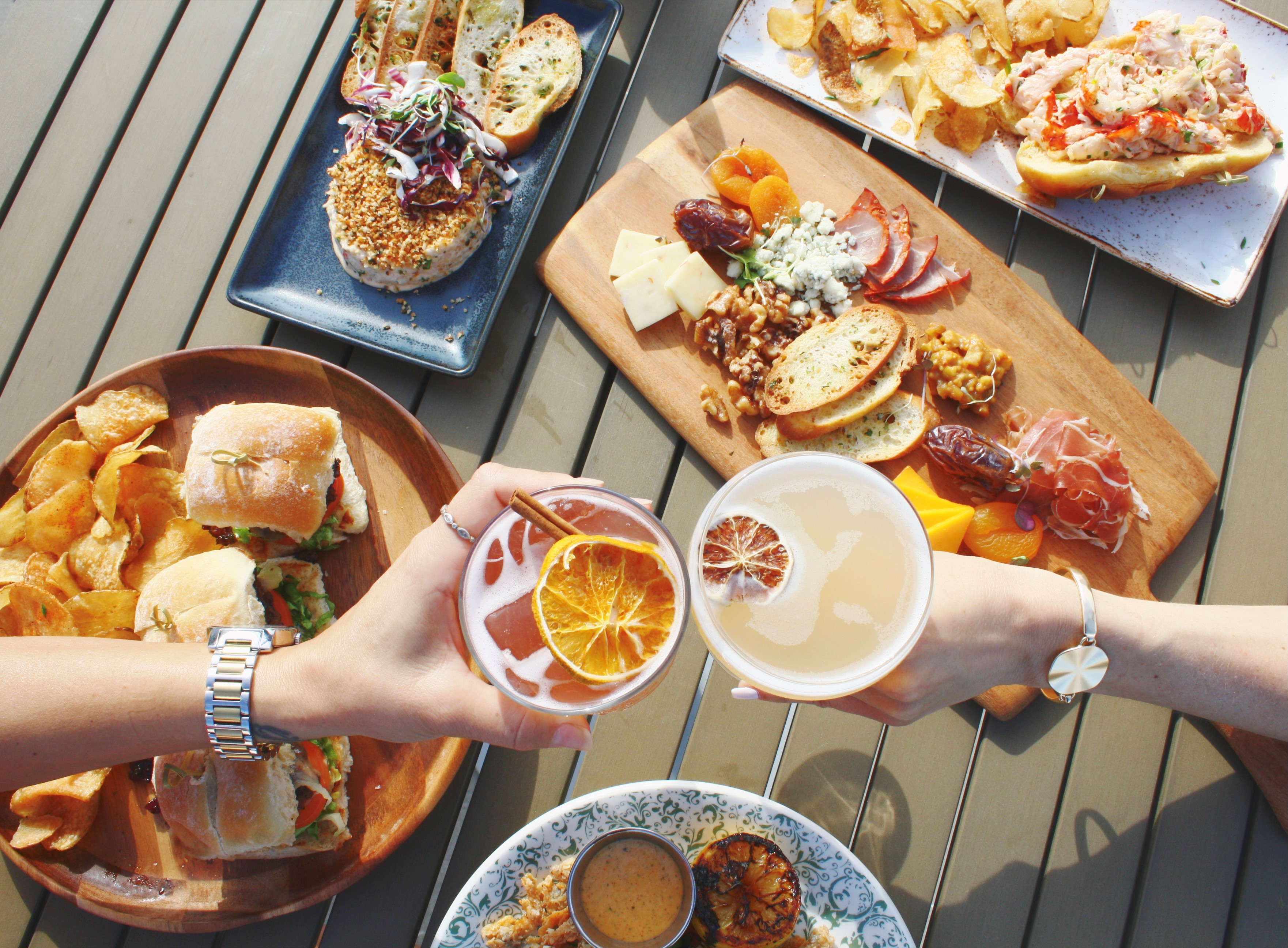 a group of people sitting at a table with a plate of food
