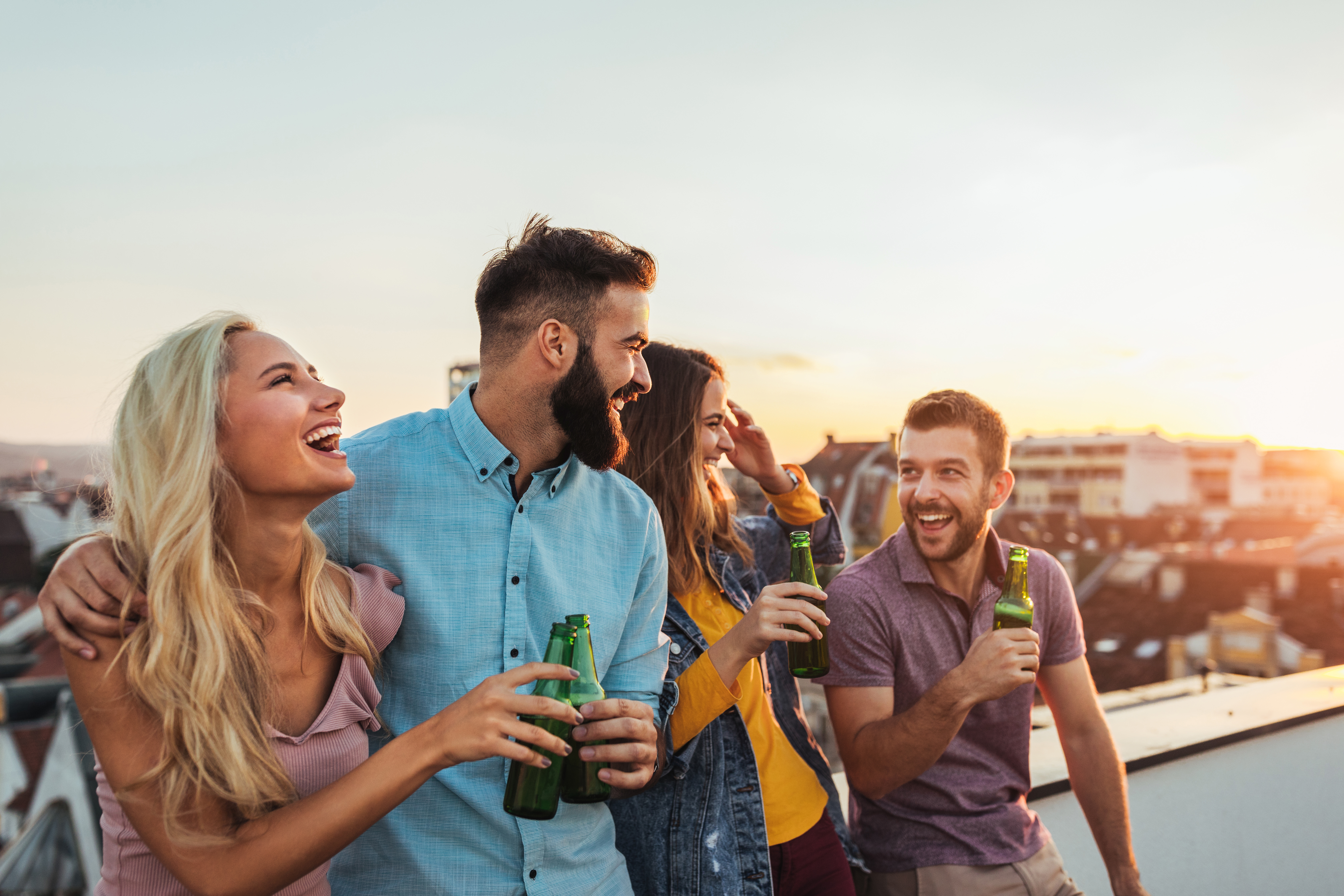 a group of people looking at a cell phone