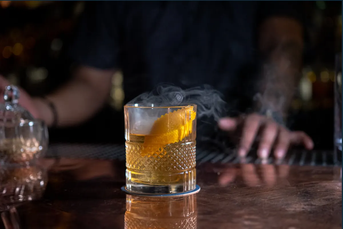 a glass of beer on a table