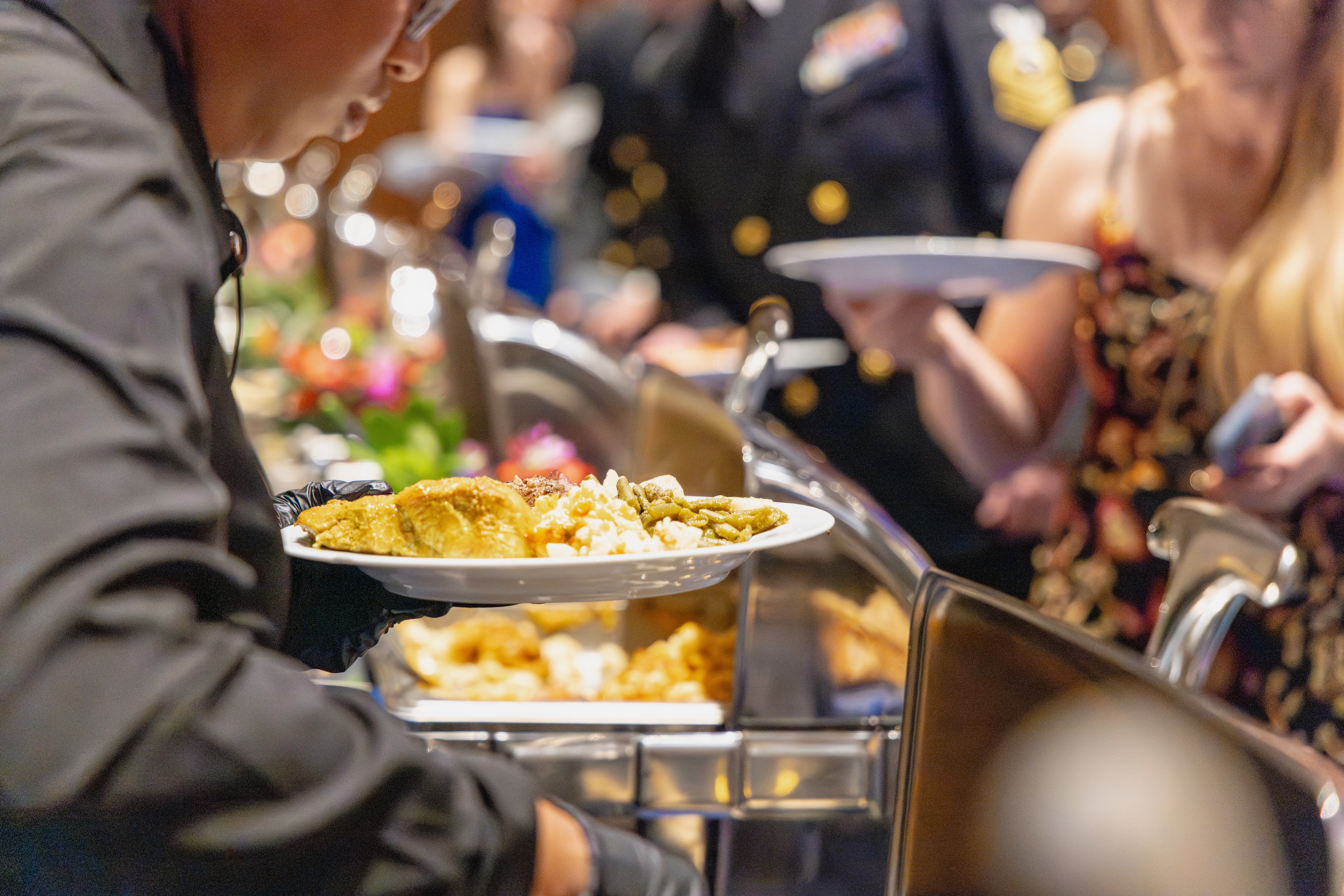 a person holding a tray of food