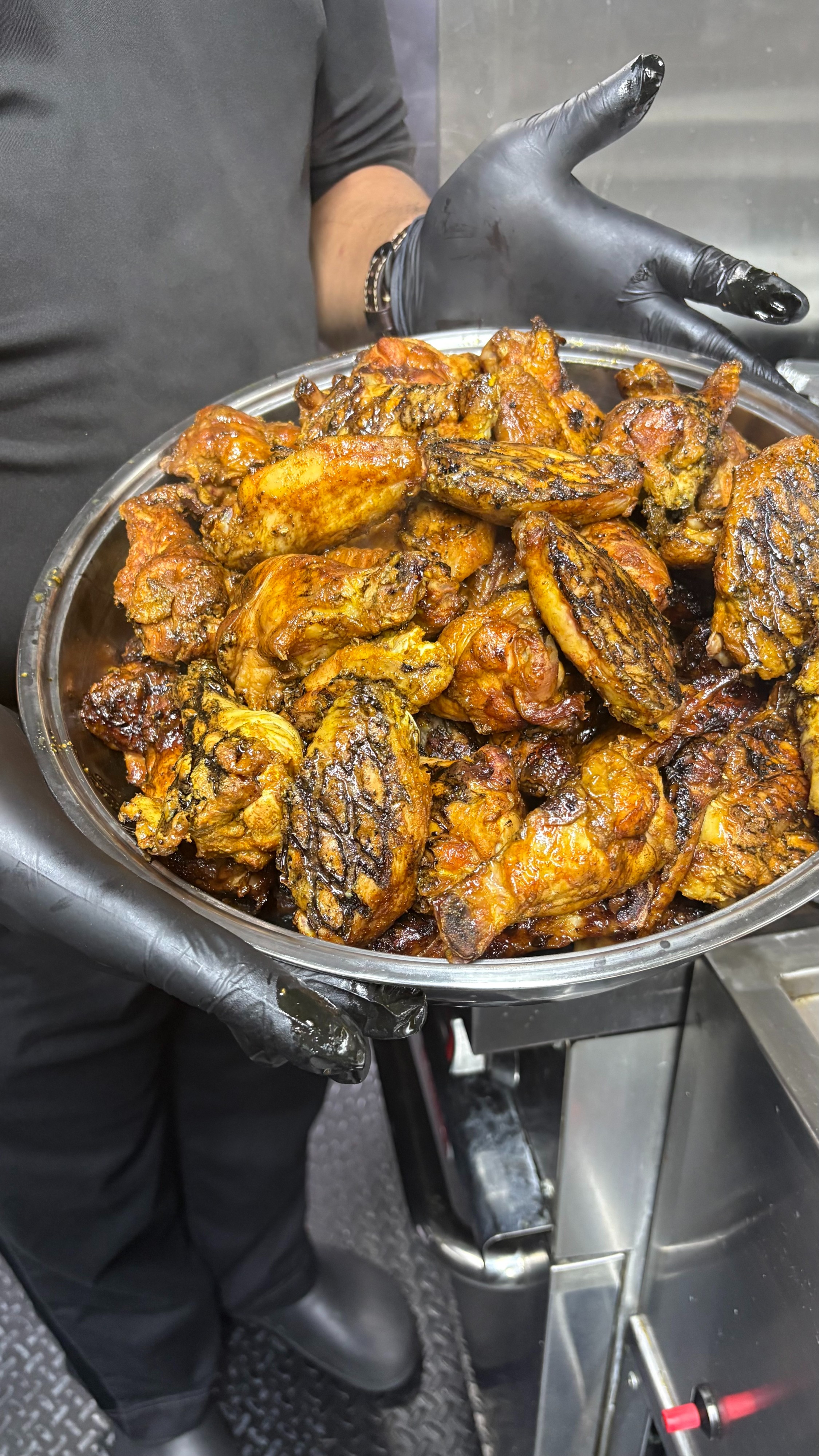 a person holding a pan of food