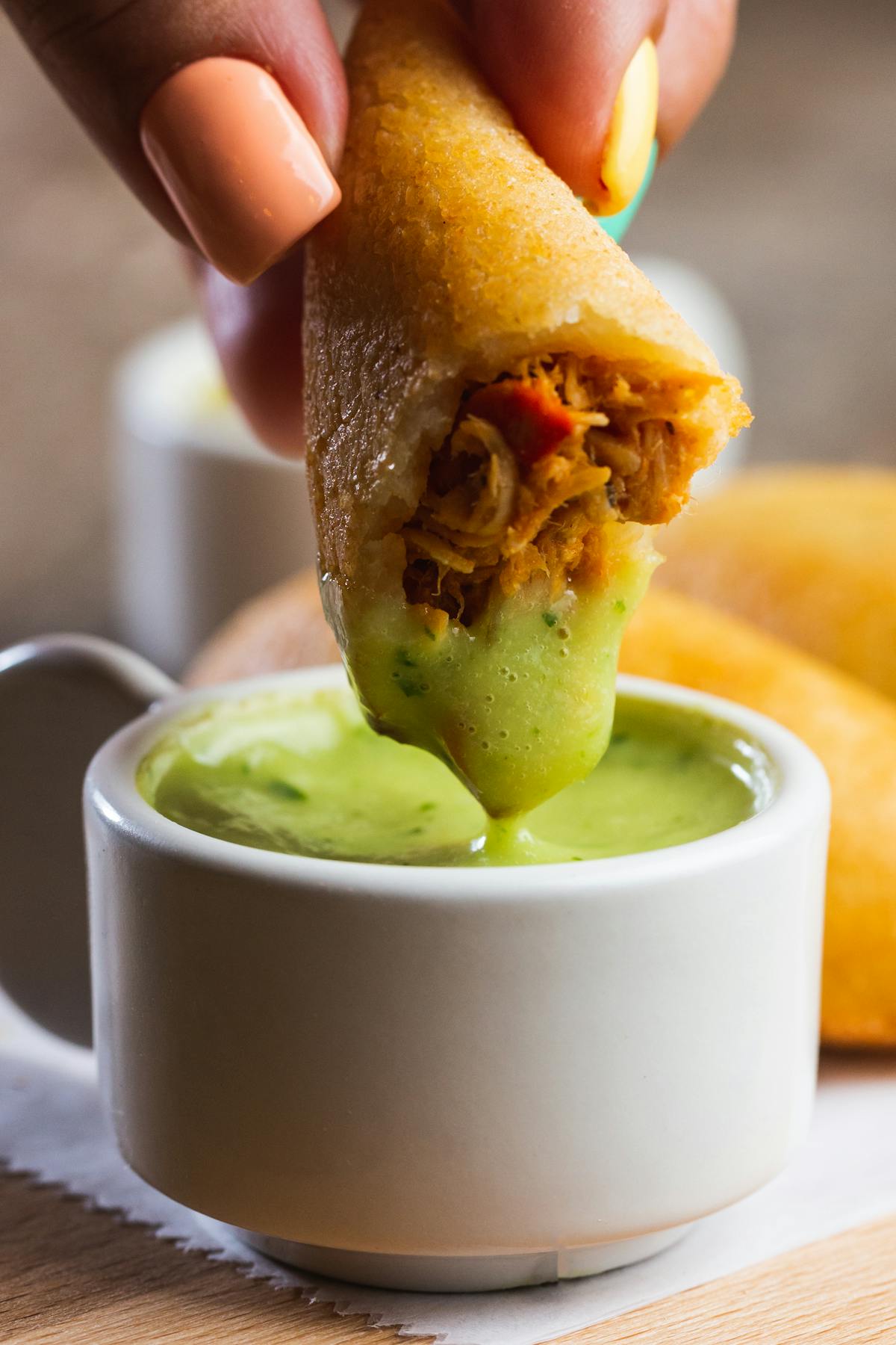 a close up of a sandwich and a cup of coffee