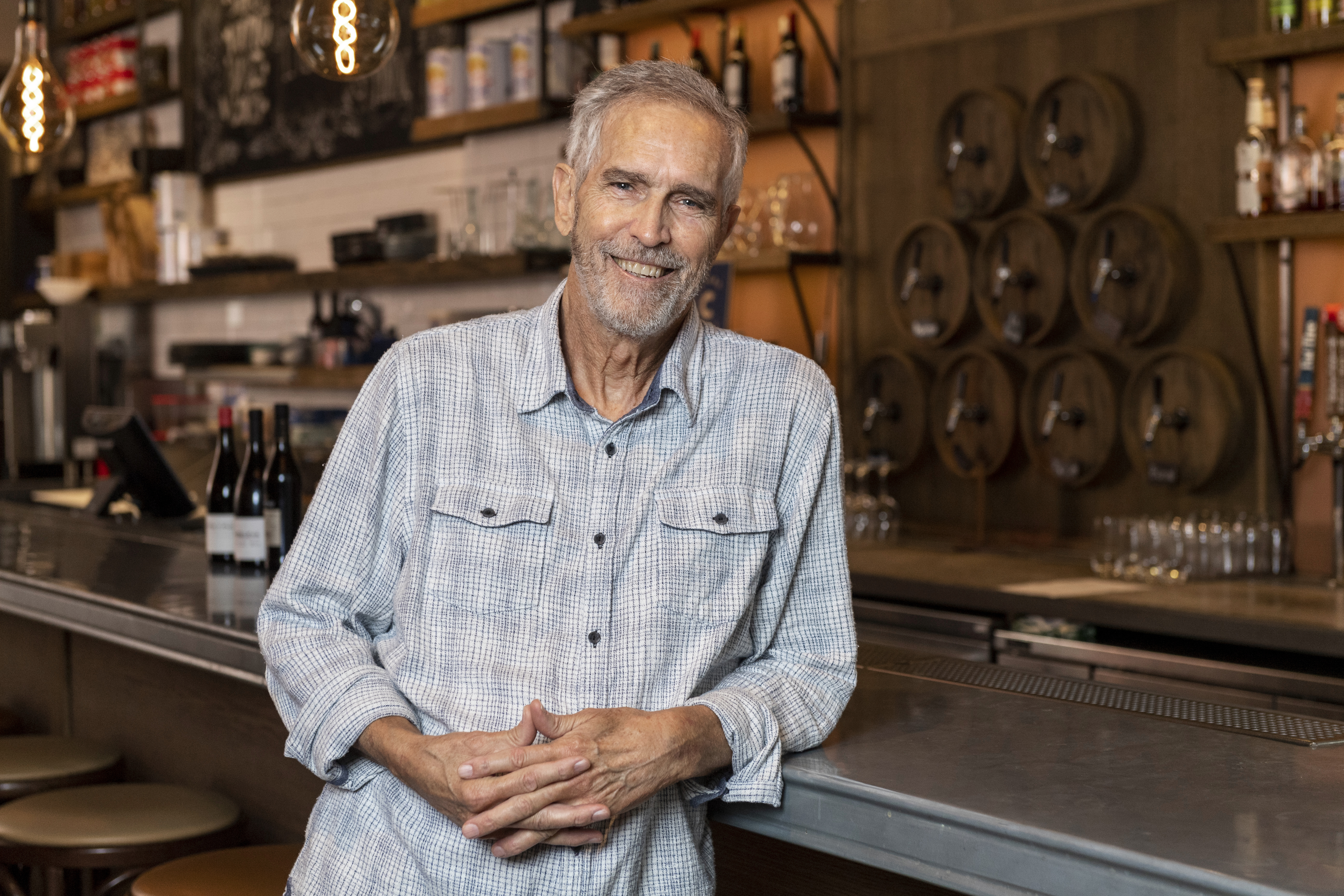 a man smiling at the camera