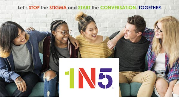a group of people sitting next to a woman