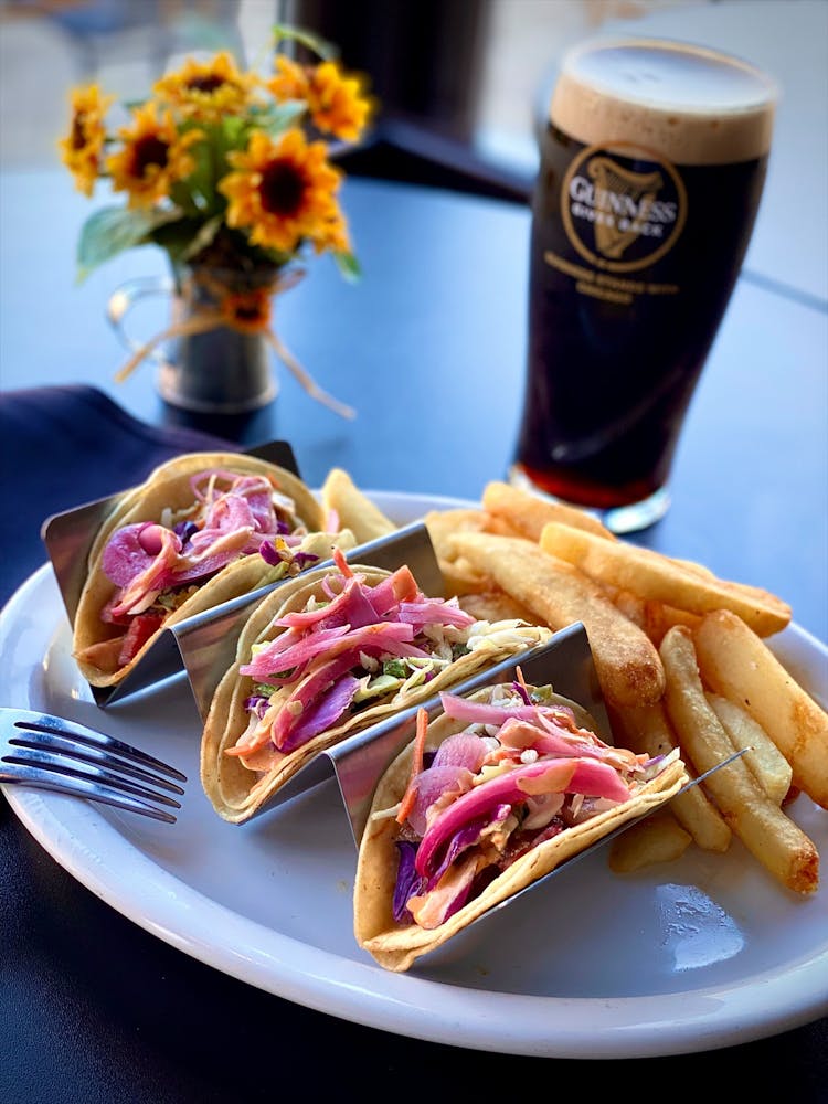 a plate with a sandwich and fries on a table