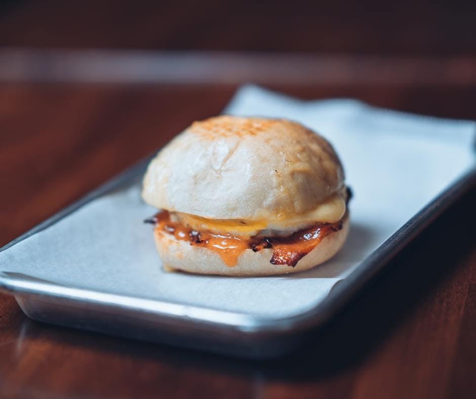 a sandwich sitting on top of a wooden table