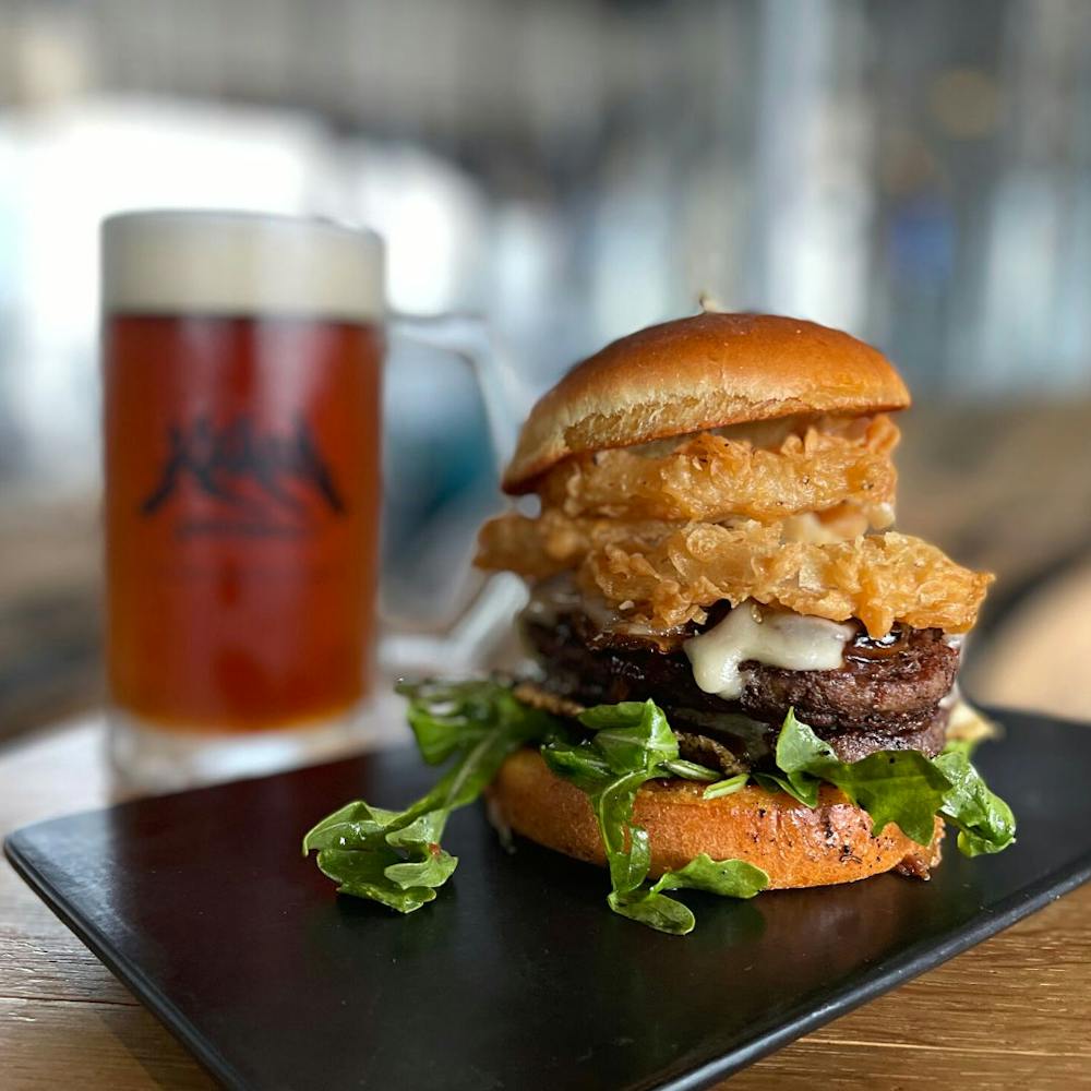 a close up of a sandwich sitting on top of a wooden table