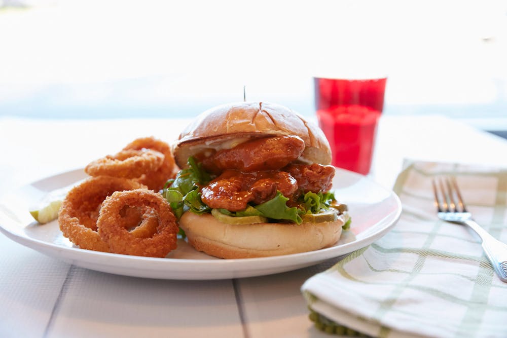 Lunch title. photo of chicken sandwich with onion rings