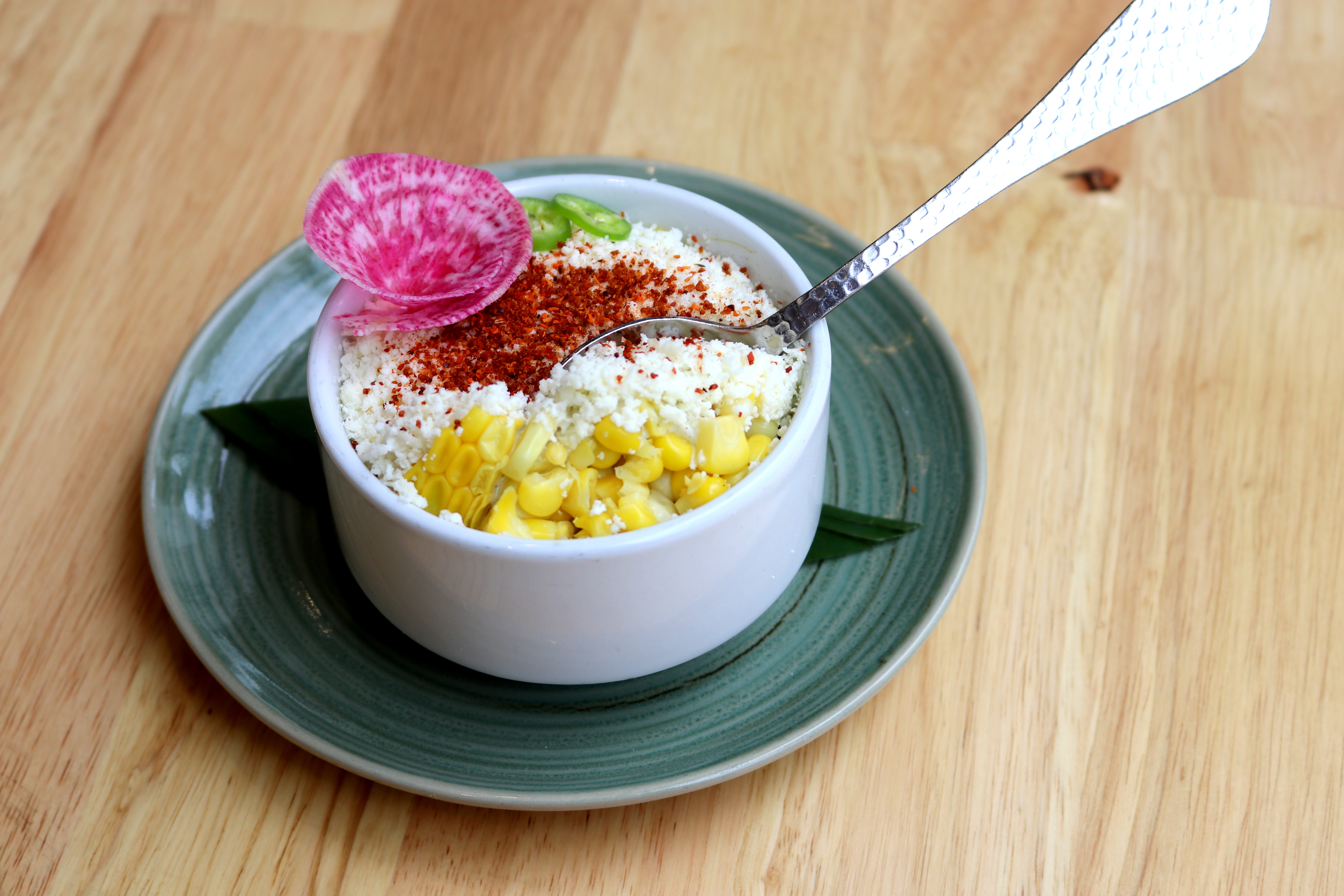 a bowl of food with a spoon