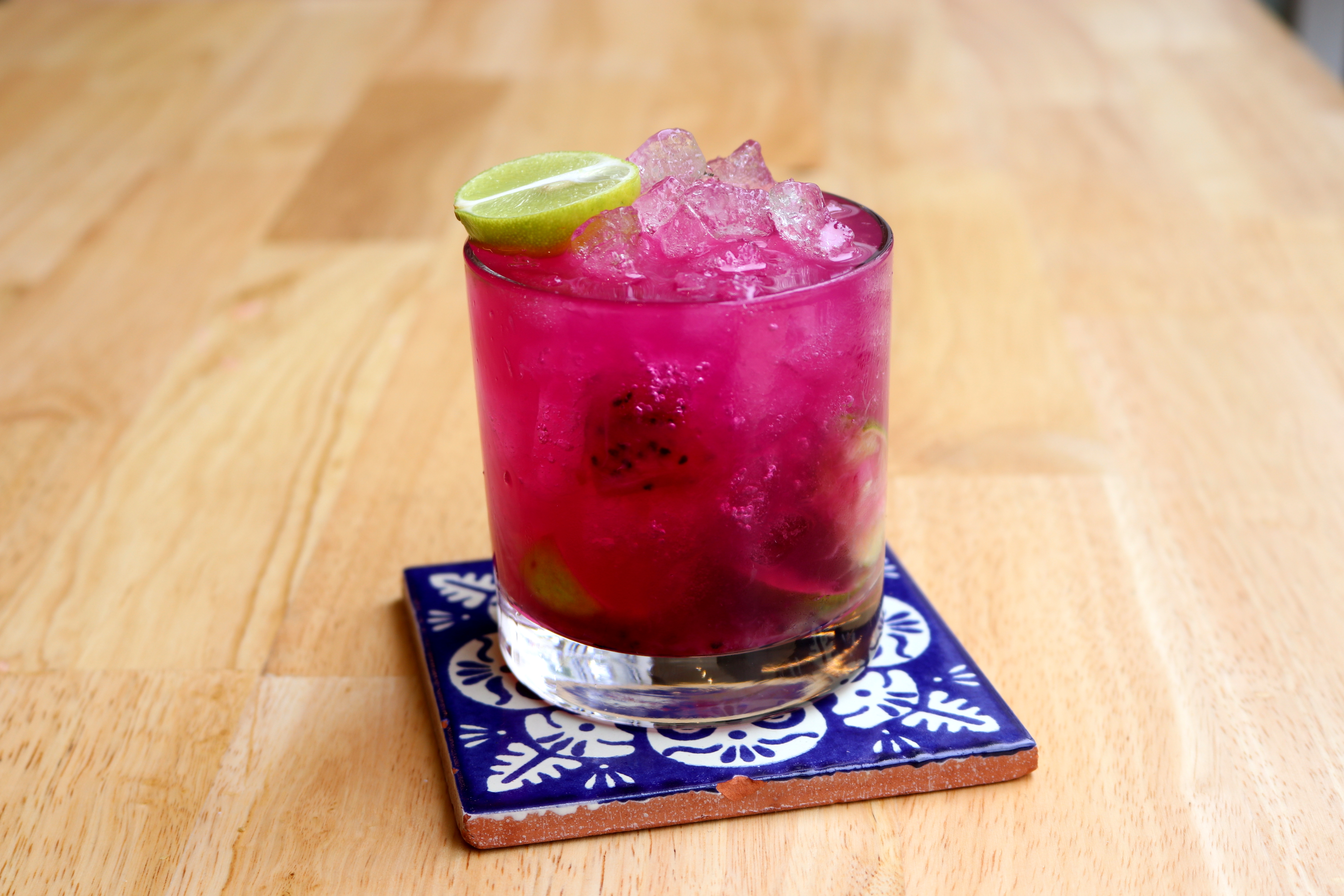 a drink with a lime slice on top of it