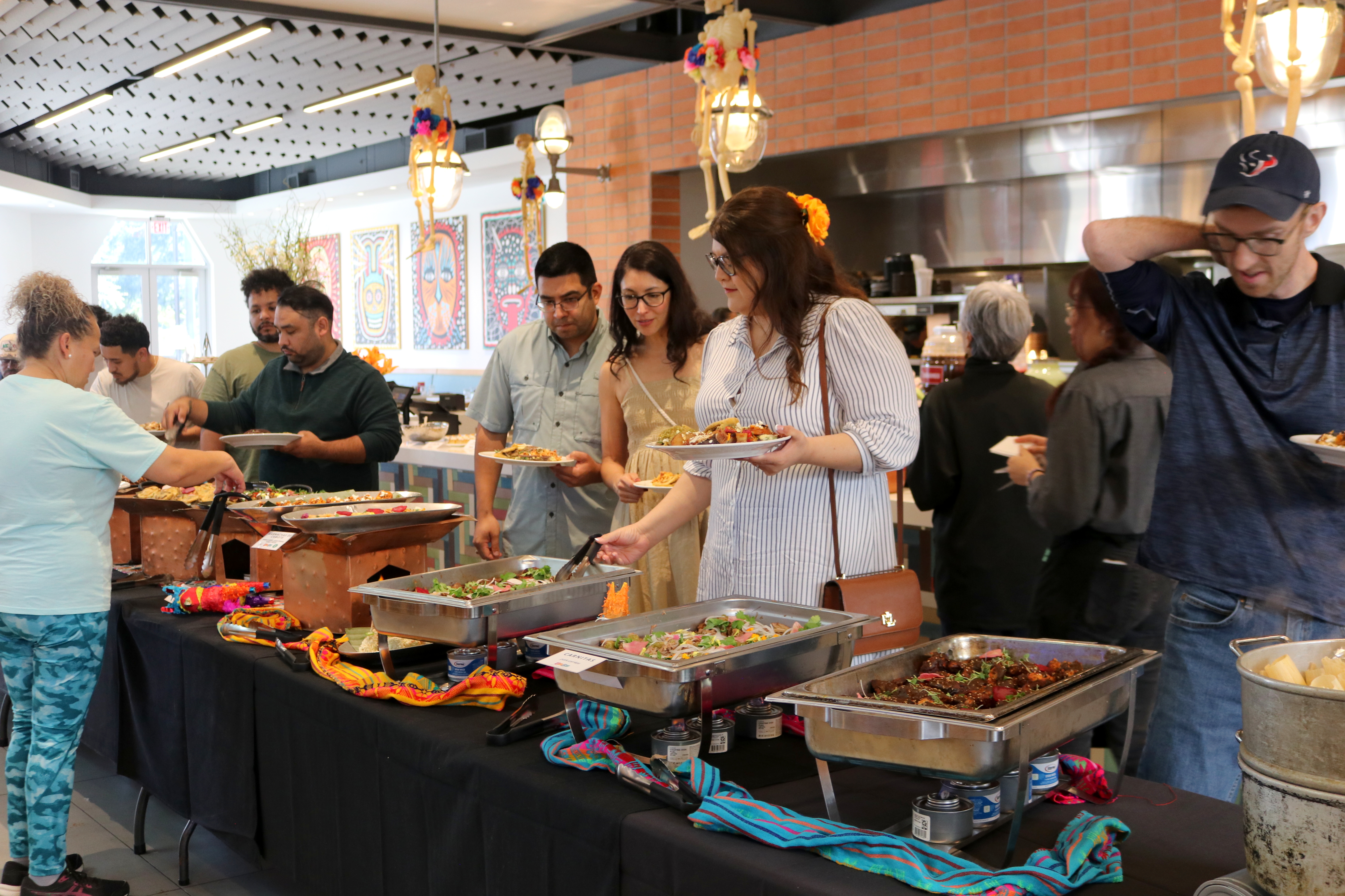 a group of people preparing food in a kitchen