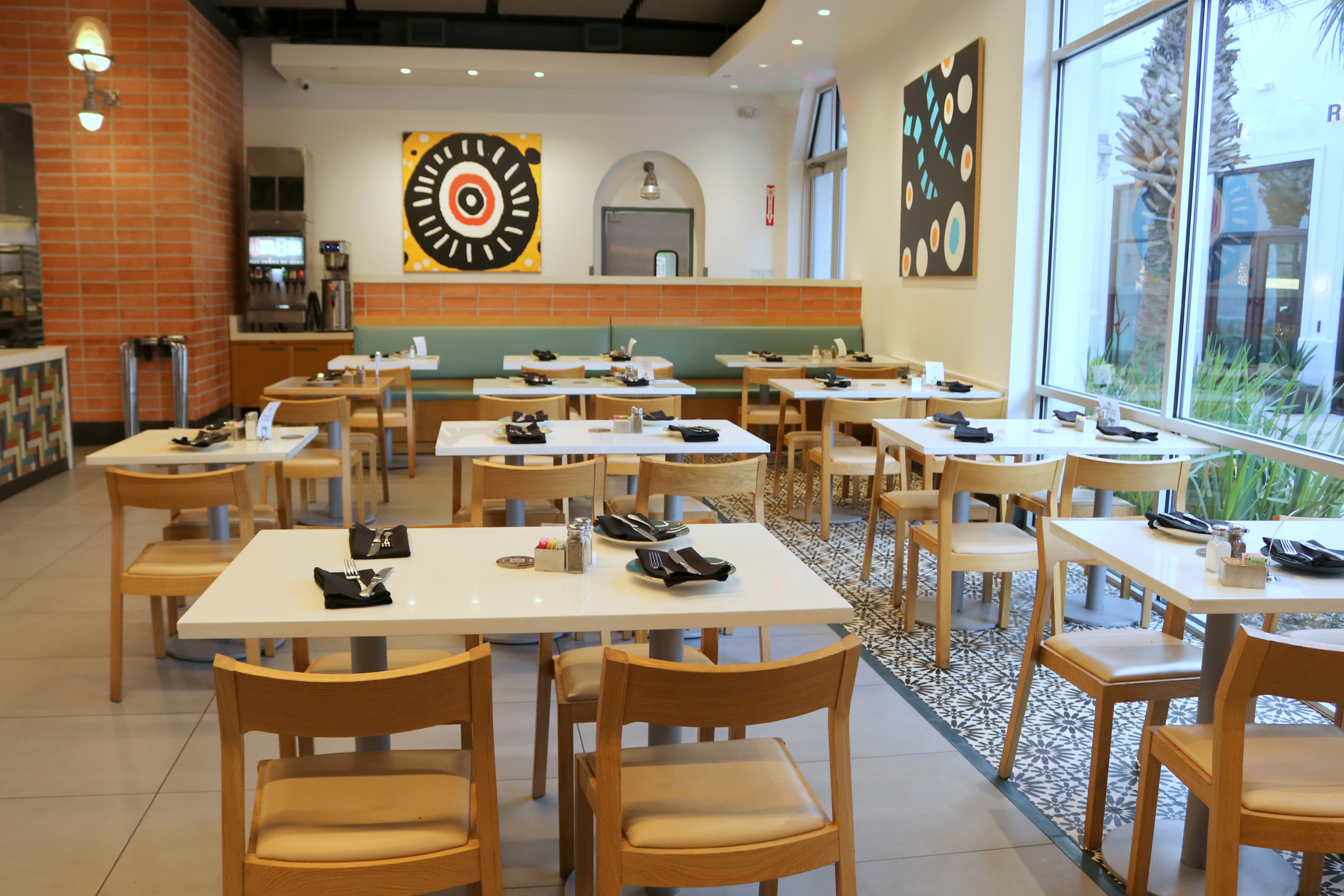 a restaurant with tables and chairs