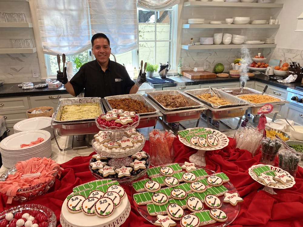 a person sitting at a table with food