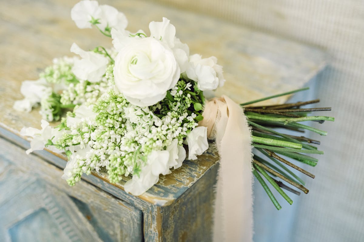 A flower bouquet sitting on a table