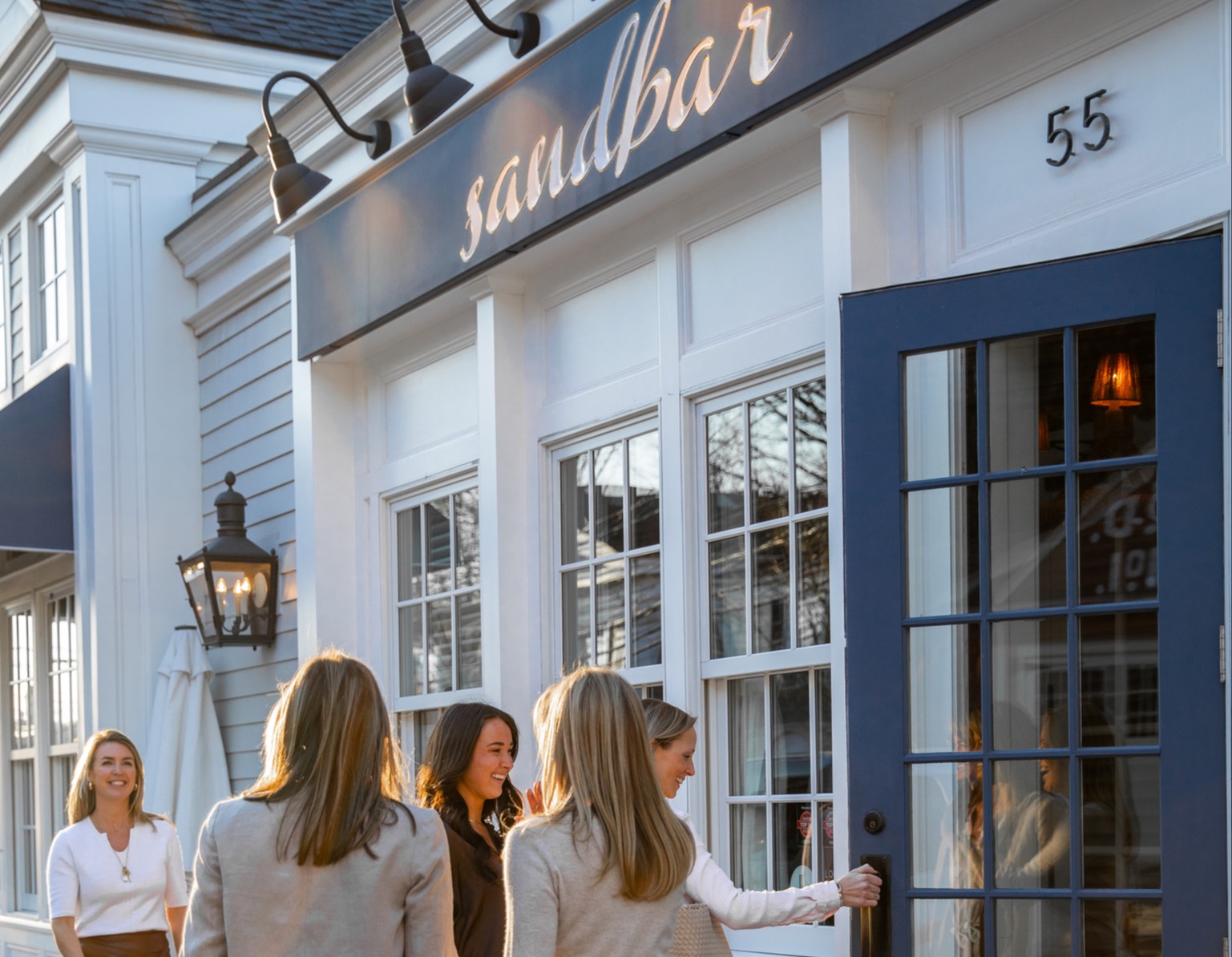 a woman standing in front of a building