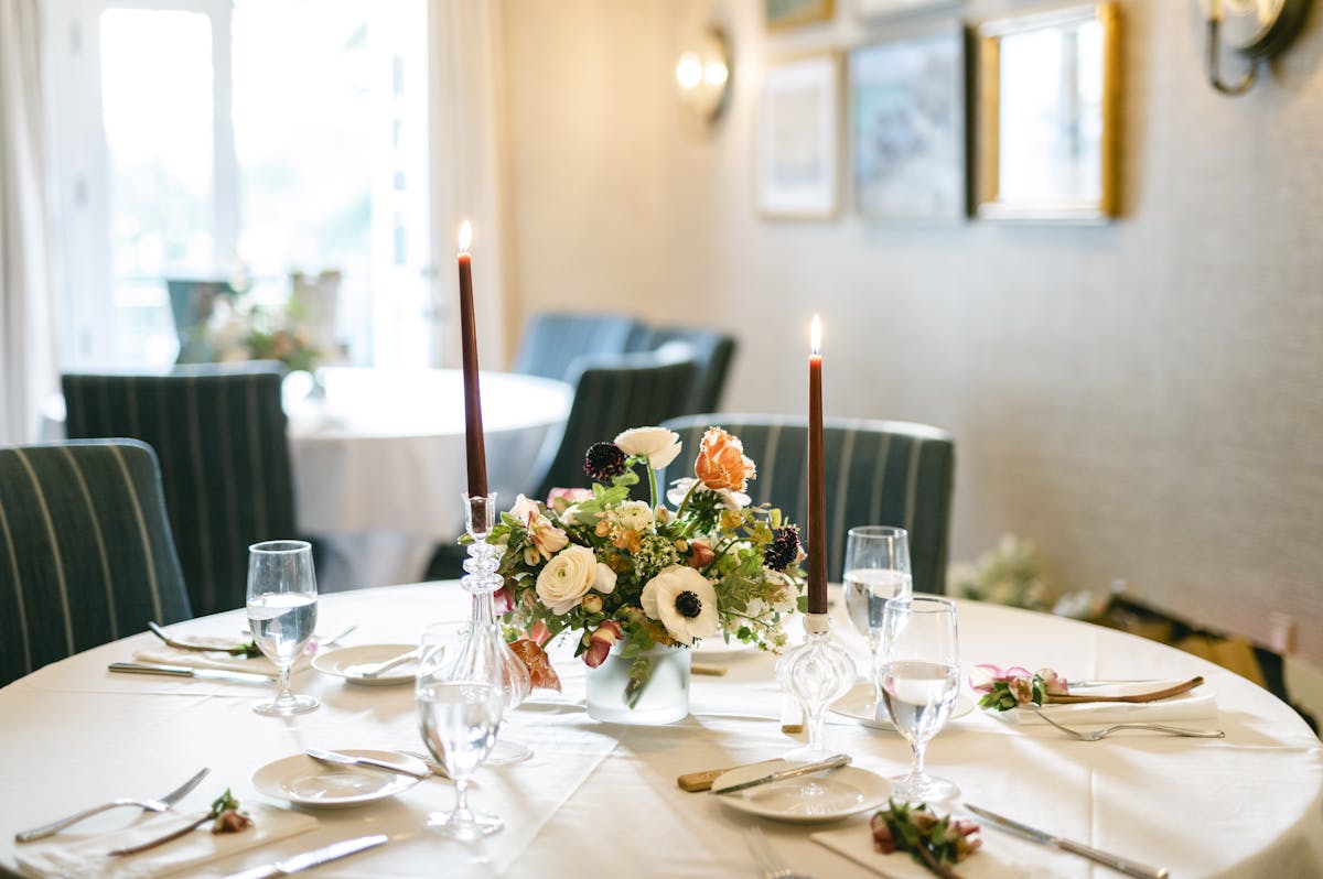 a dining table with wine glasses