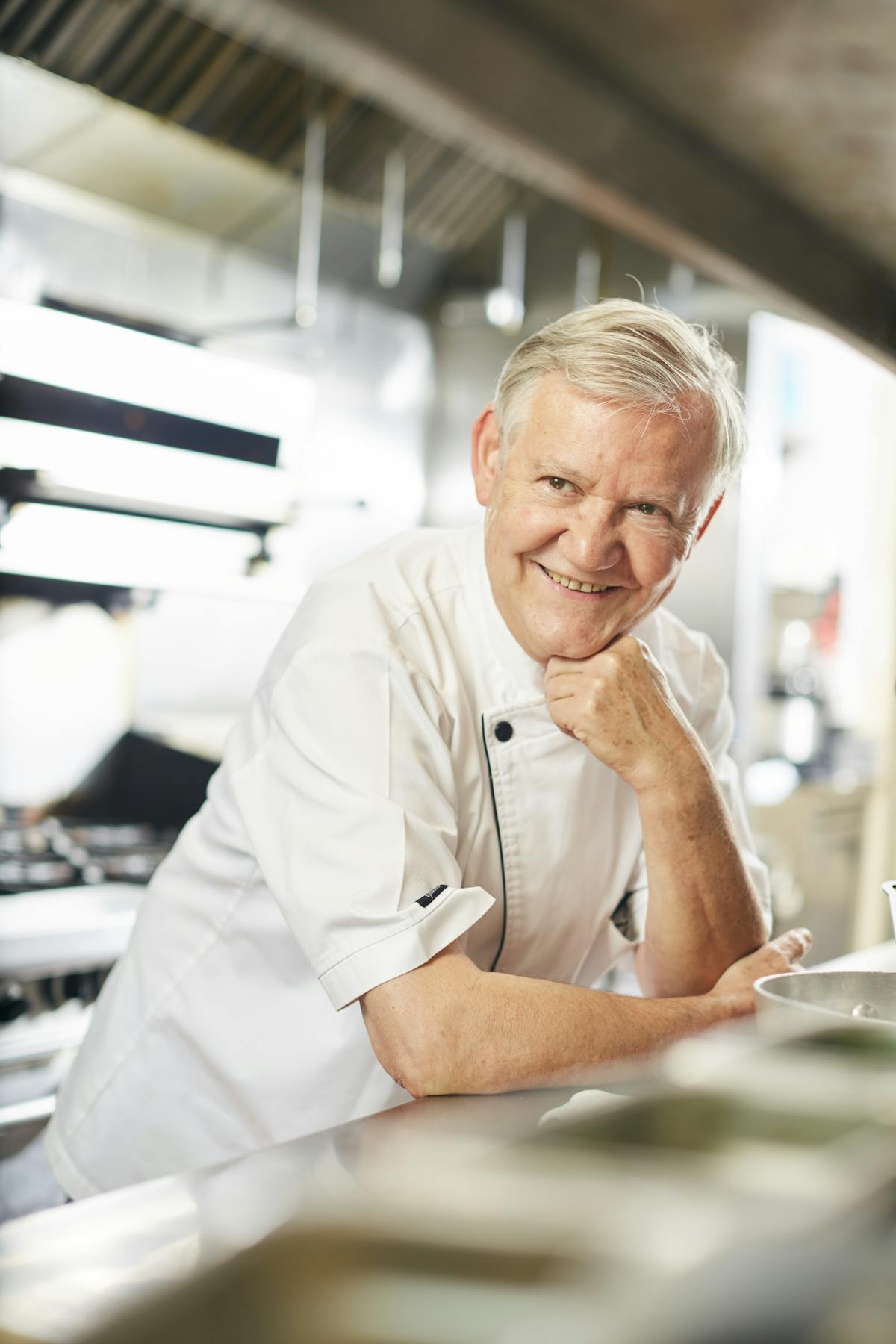 a man preparing food in a kitchen