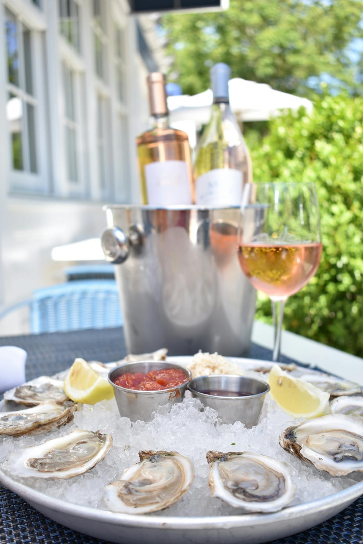 a plate of food and a glass of wine