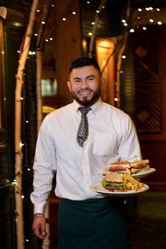 a man standing in front of a plate of food