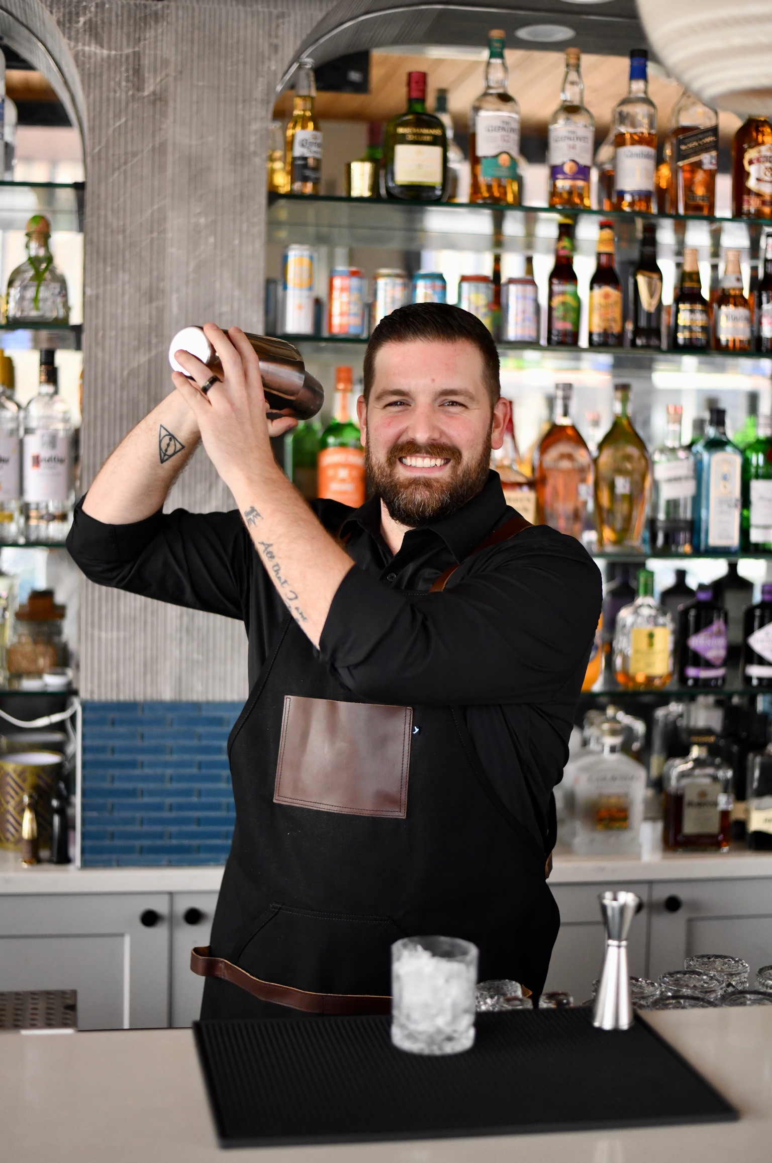 a person standing in front of a mirror posing for the camera