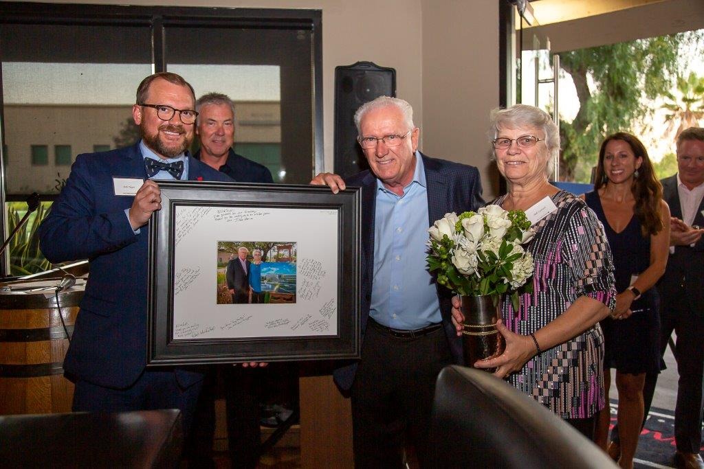 a group of people holding a picture