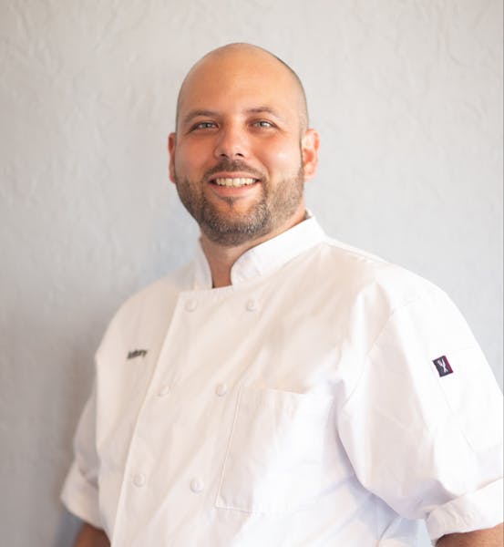 a man wearing a white shirt