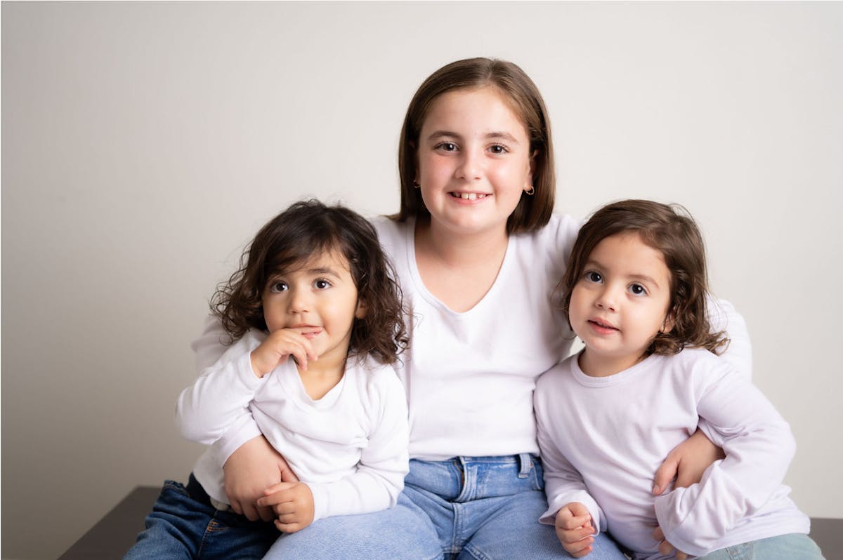 a group of people sitting posing for the camera