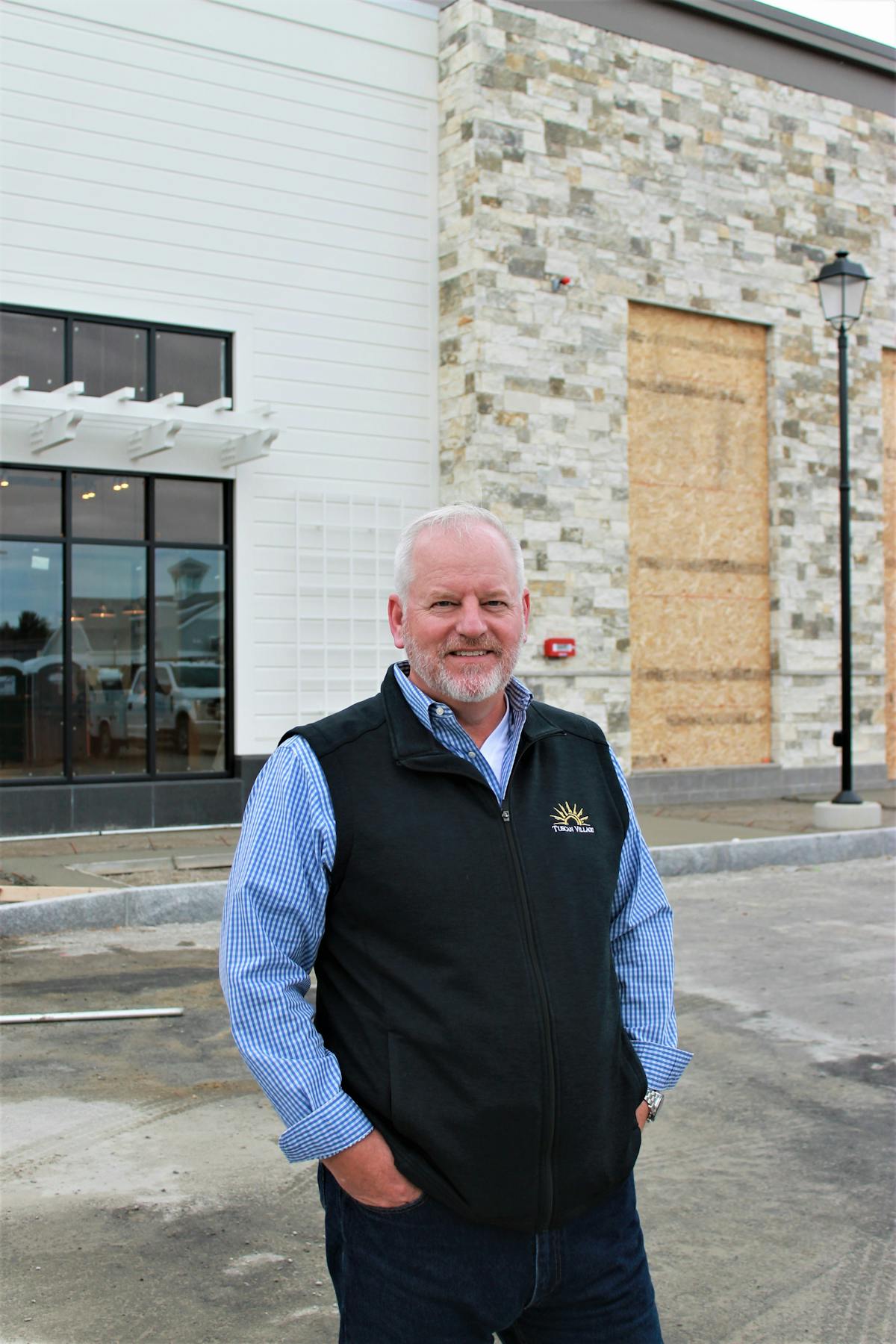 a man standing in front of a building