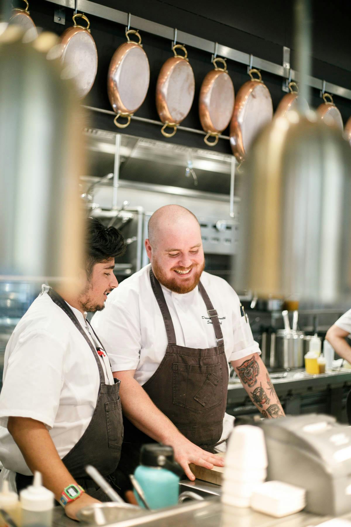 a man cooking in a kitchen preparing food