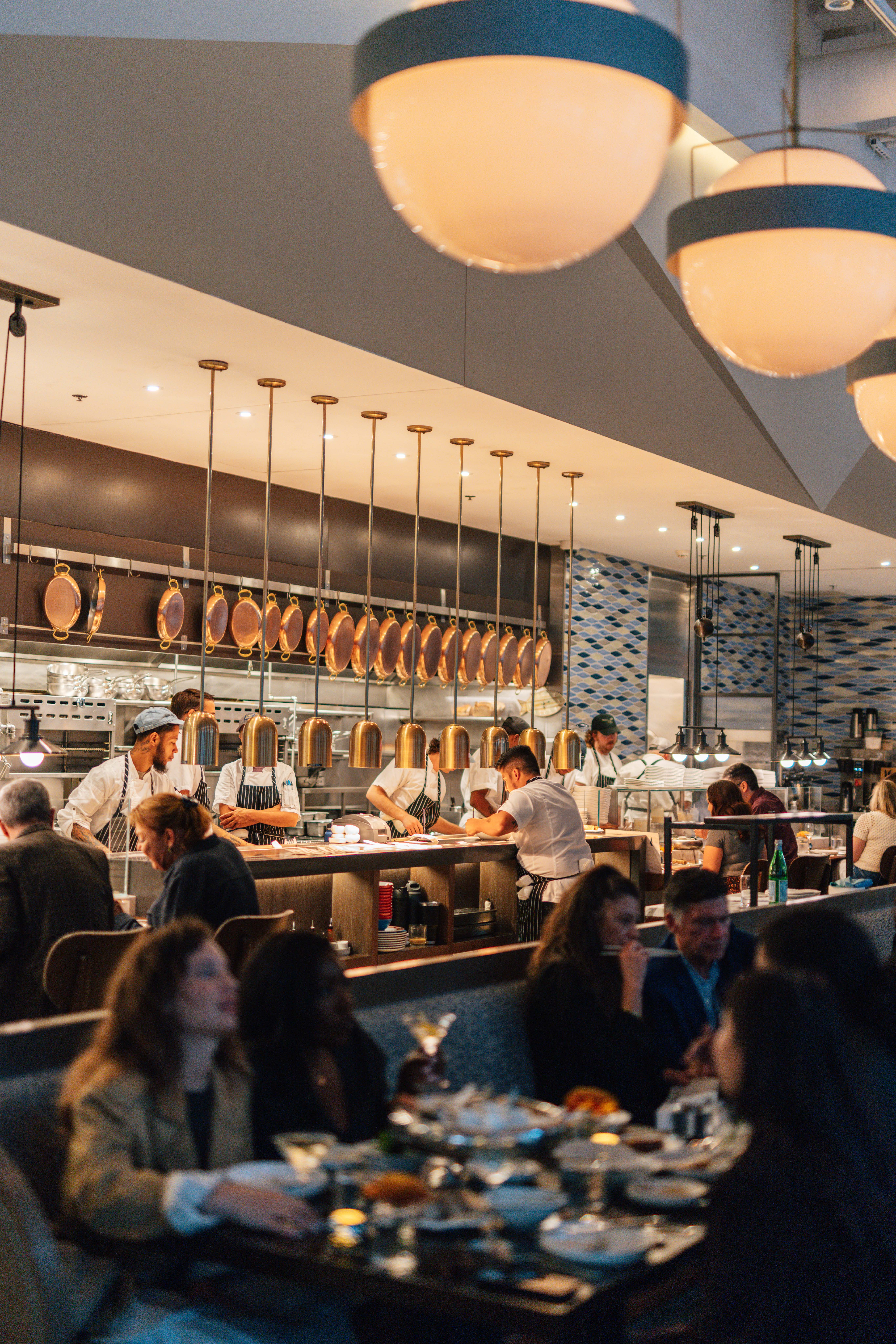 people sitting at a restaurant counter