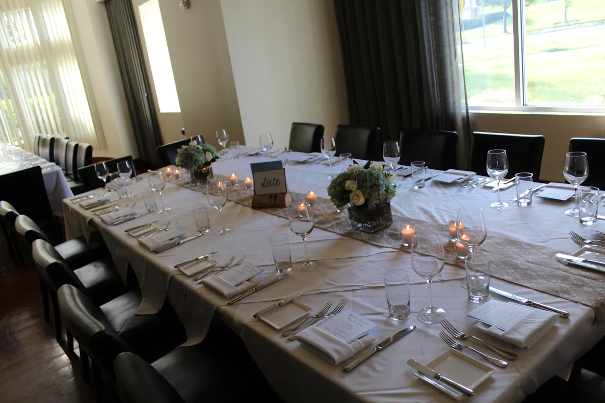 a dining room table in front of a window