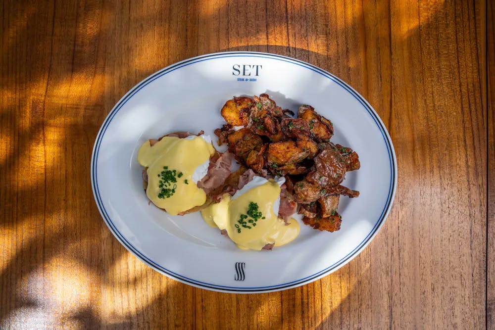 a plate of food on a wooden table