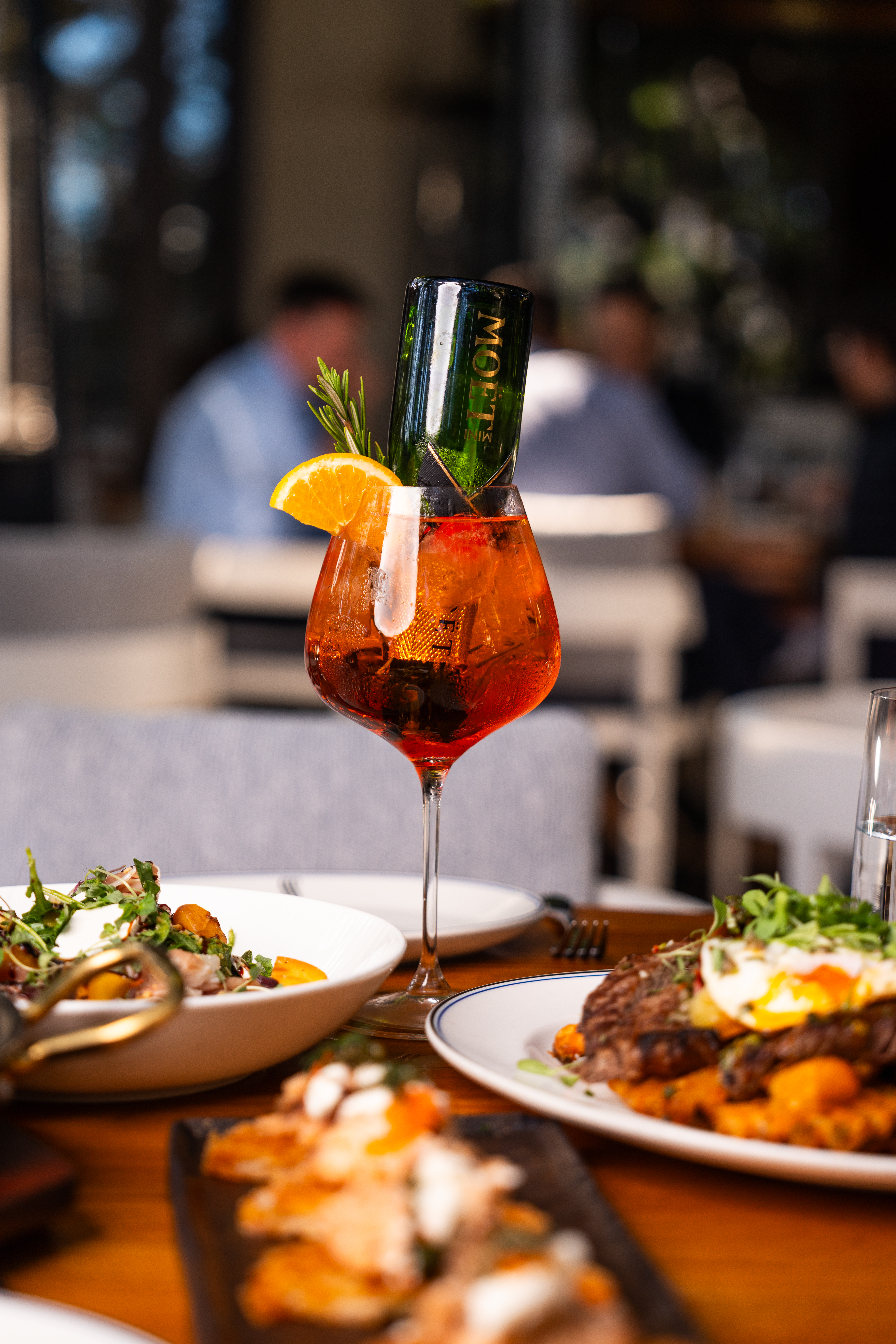 a plate of food and a glass of wine