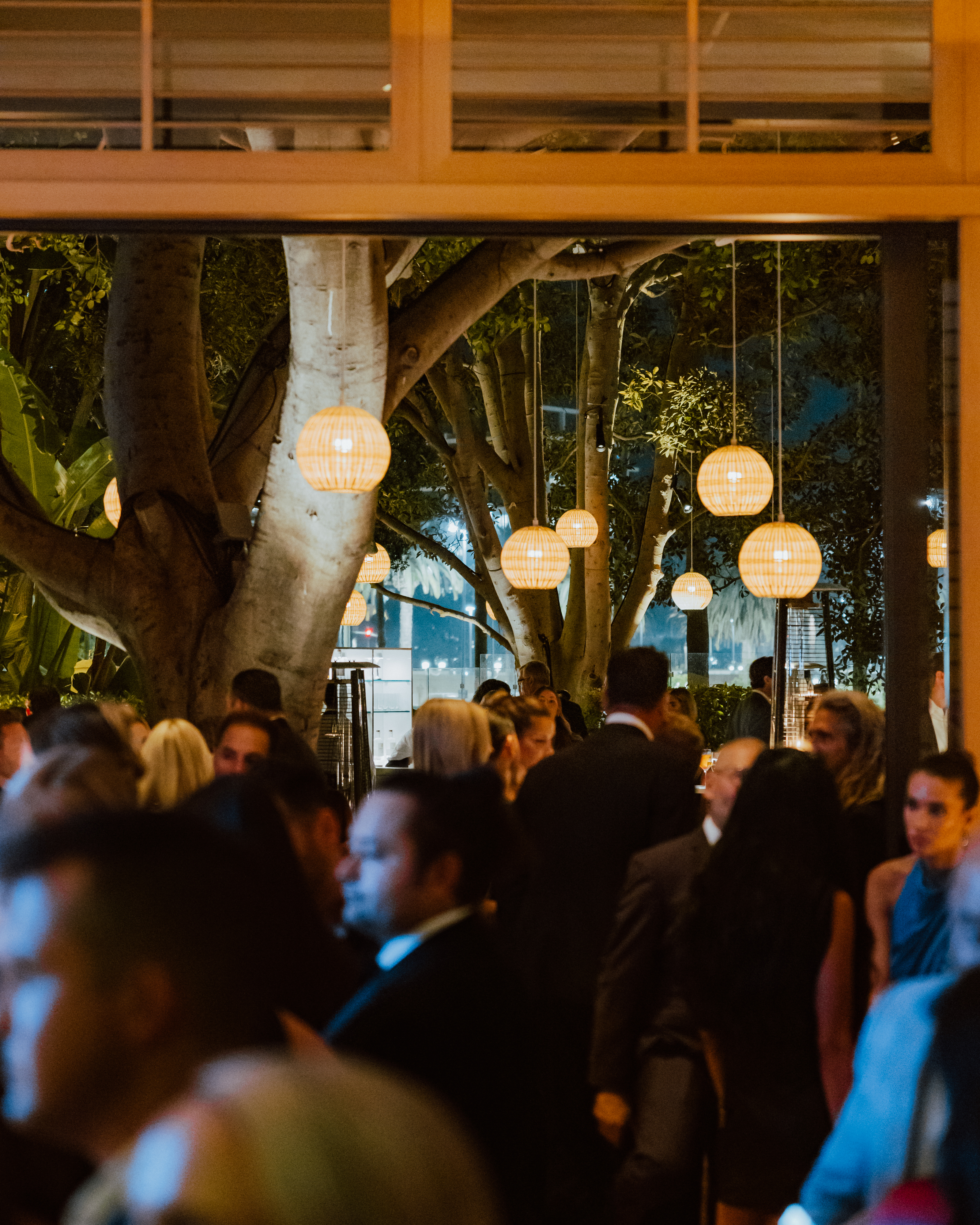 a group of people standing in front of a crowd