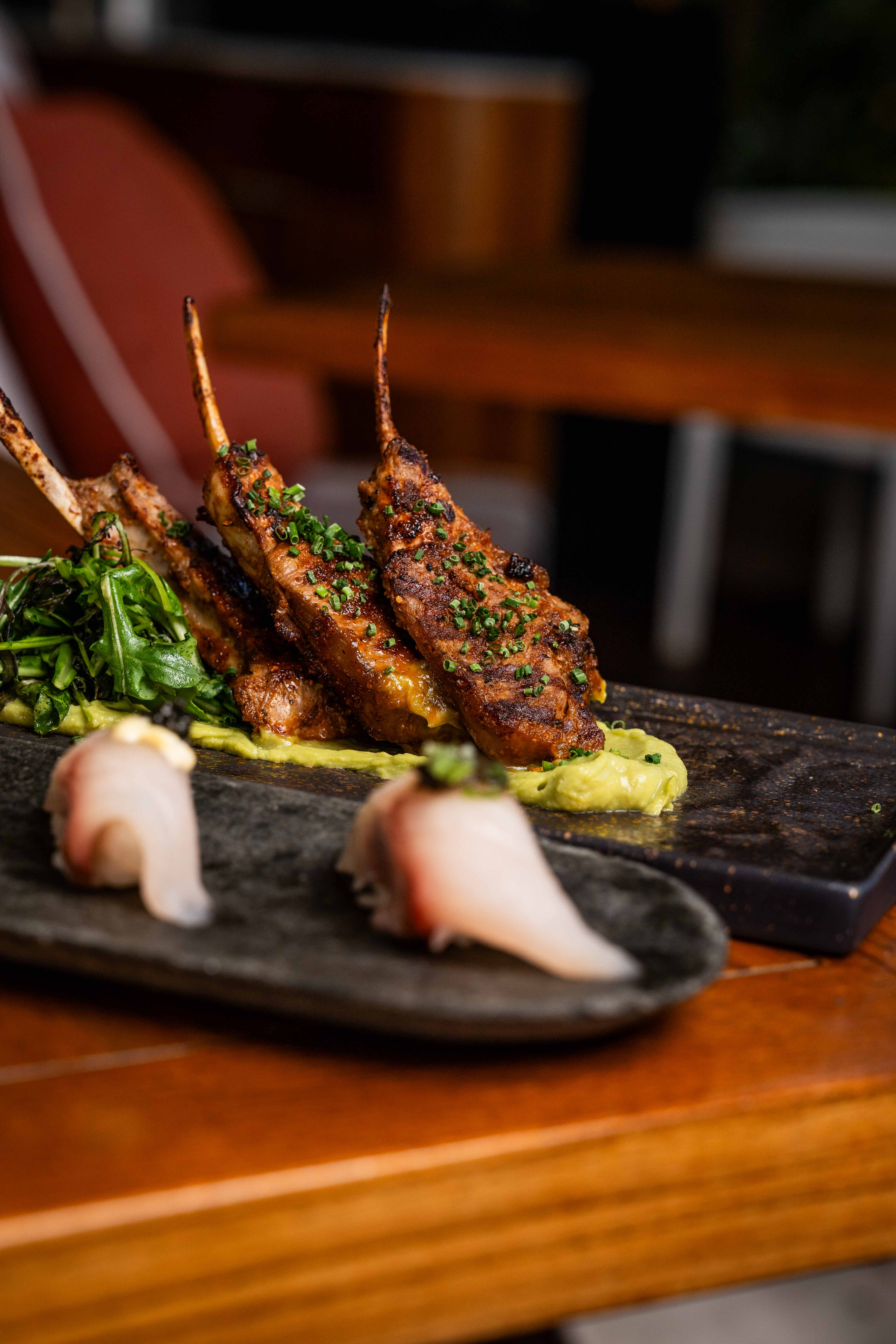 a close up of food on a wooden cutting board