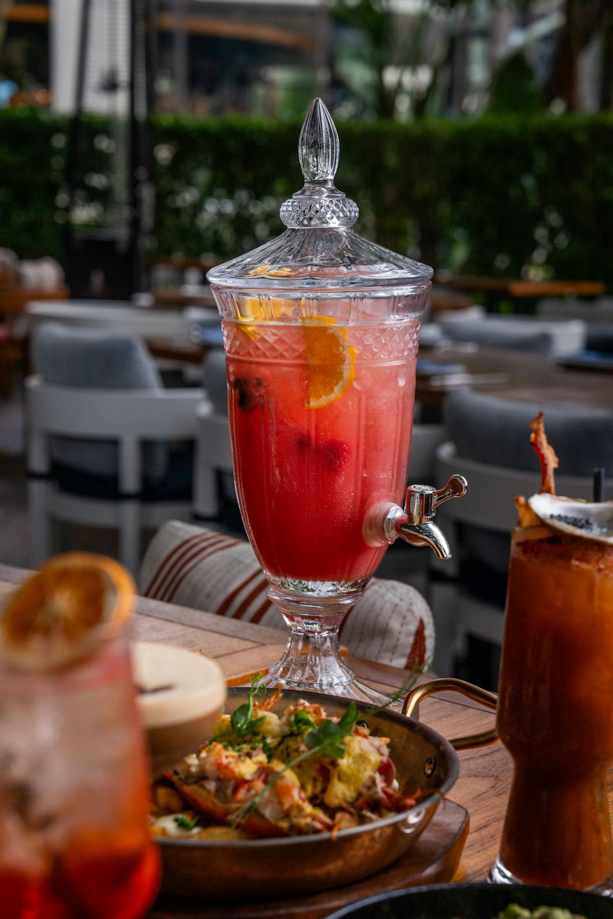 a plate of food and a glass of beer on a table