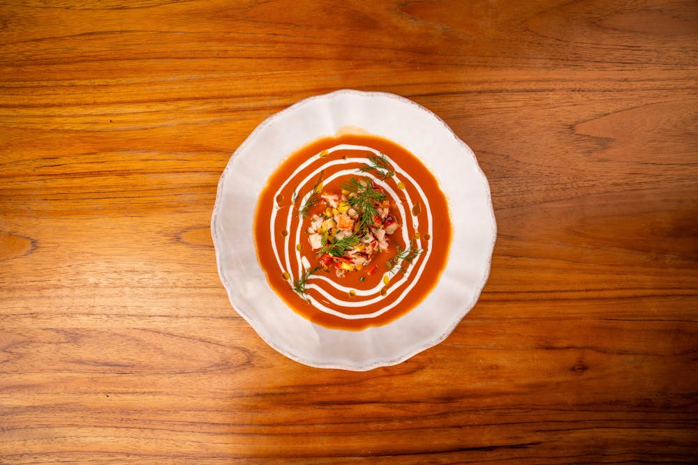 a close up of a plate on a wooden surface
