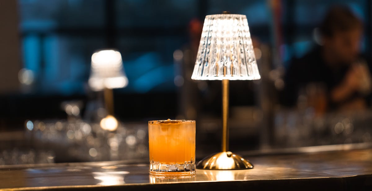 a glass of beer on a table