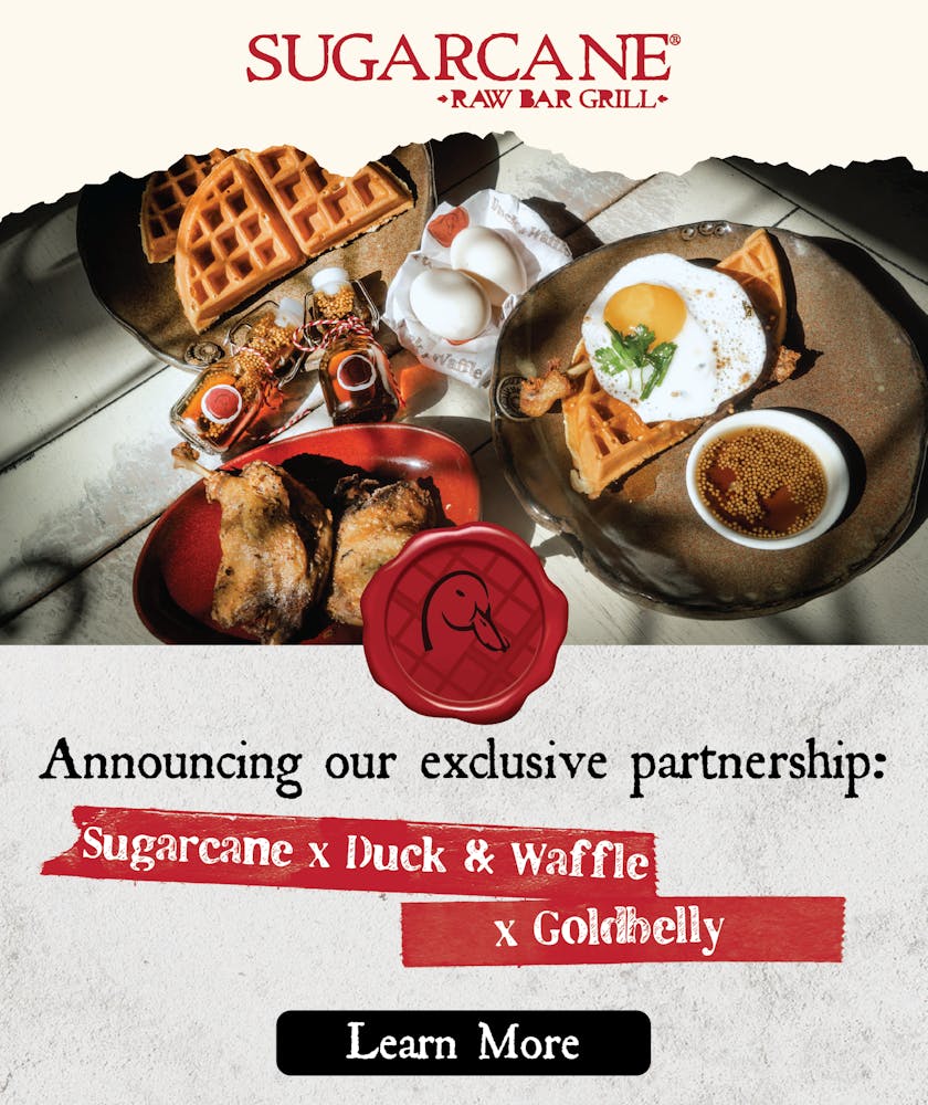 Beautiful, homestyle Duck & Waffle meal kit presentation including fluffy waffles on a plate, duck eggs, handsomely packaged bottles of mustard-maple syrup, succulent duck leg confit, and a fully plated dish on a farmhouse table.