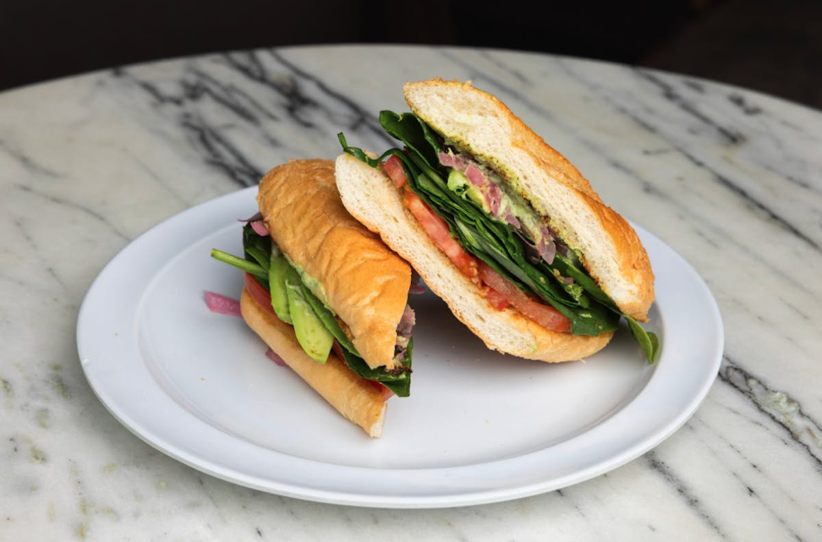 a sandwich cut in half on a plate