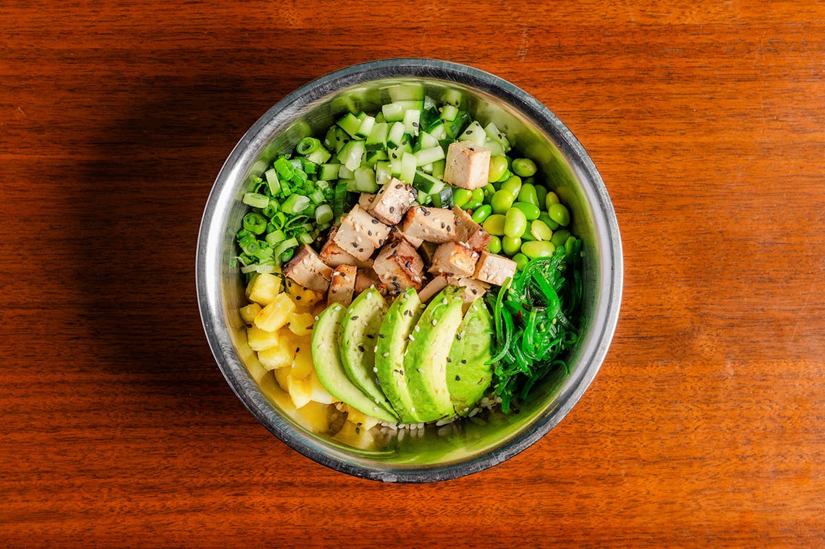 a bowl of food with broccoli